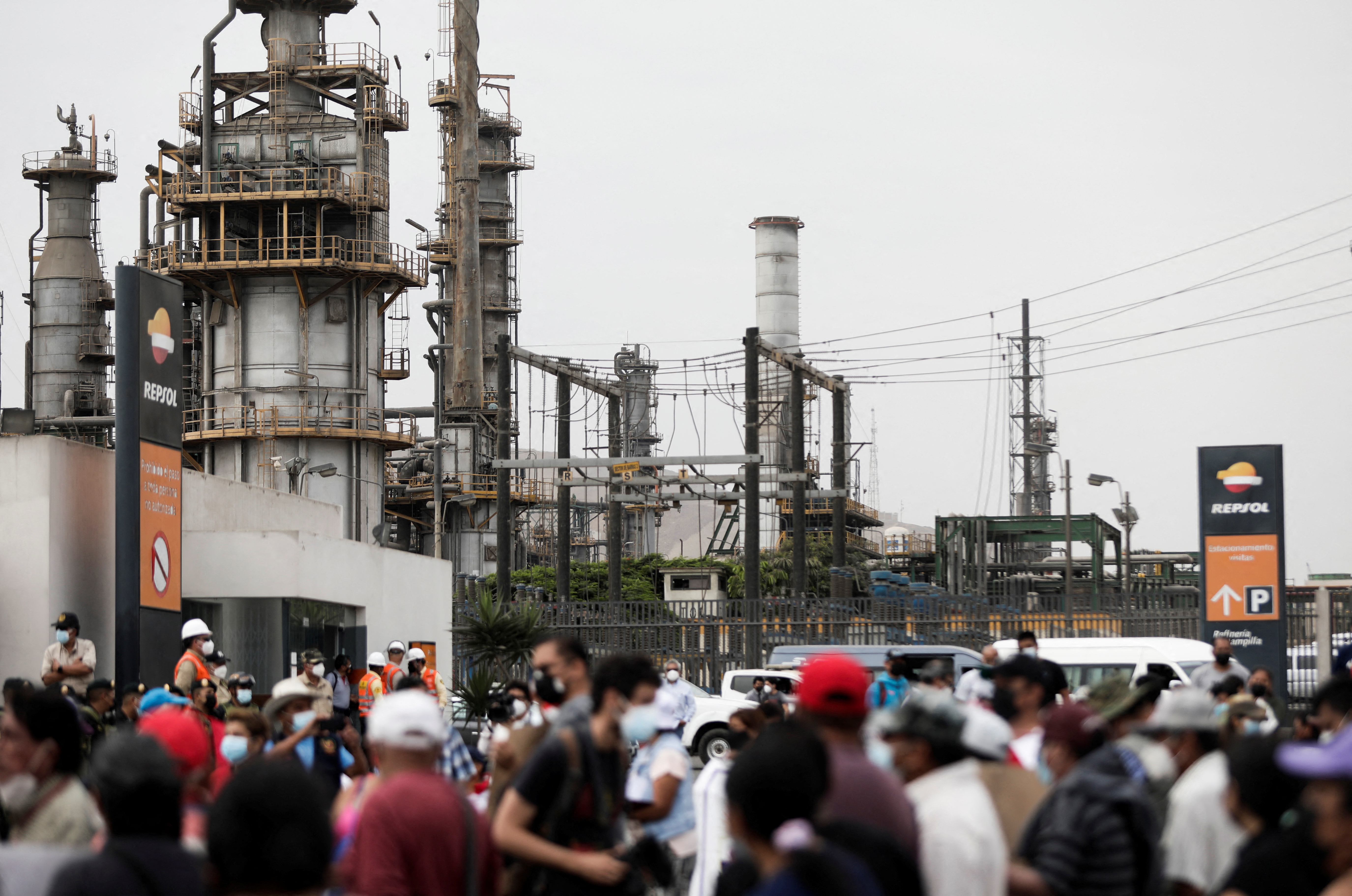 Demonstrators take part in a protest outside Repsol's La Pampilla refinery in Ventanilla