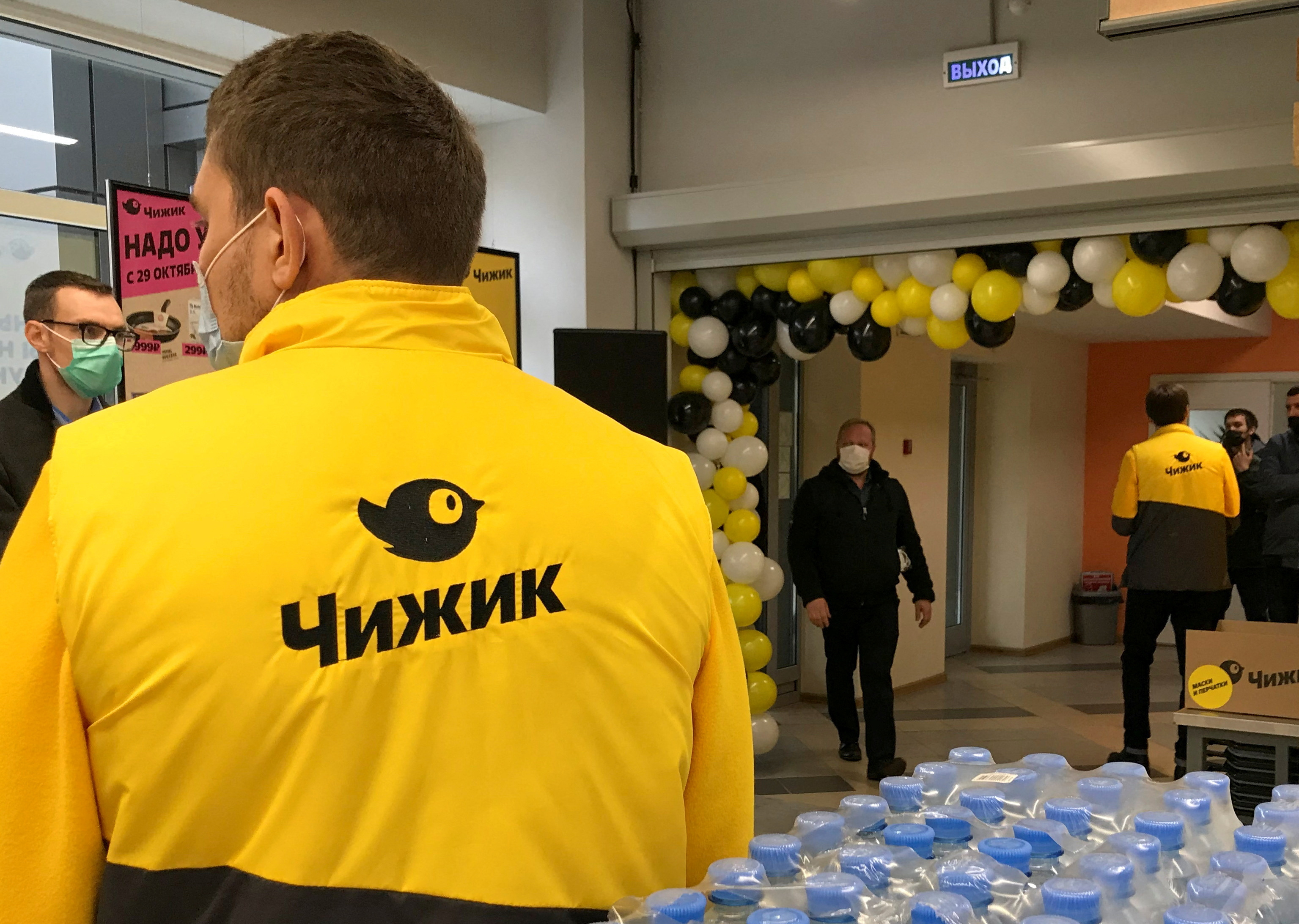 Employees attend a ceremony to launch the discount shop Chizhik in Moscow