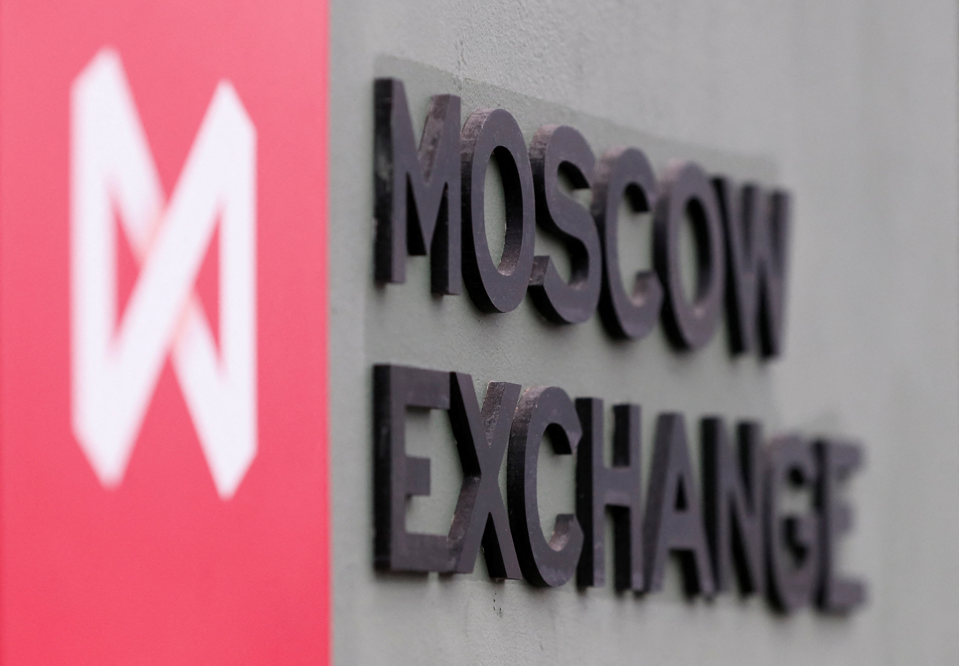 A board with the logo of the Moscow Exchange is on display in its office in Moscow