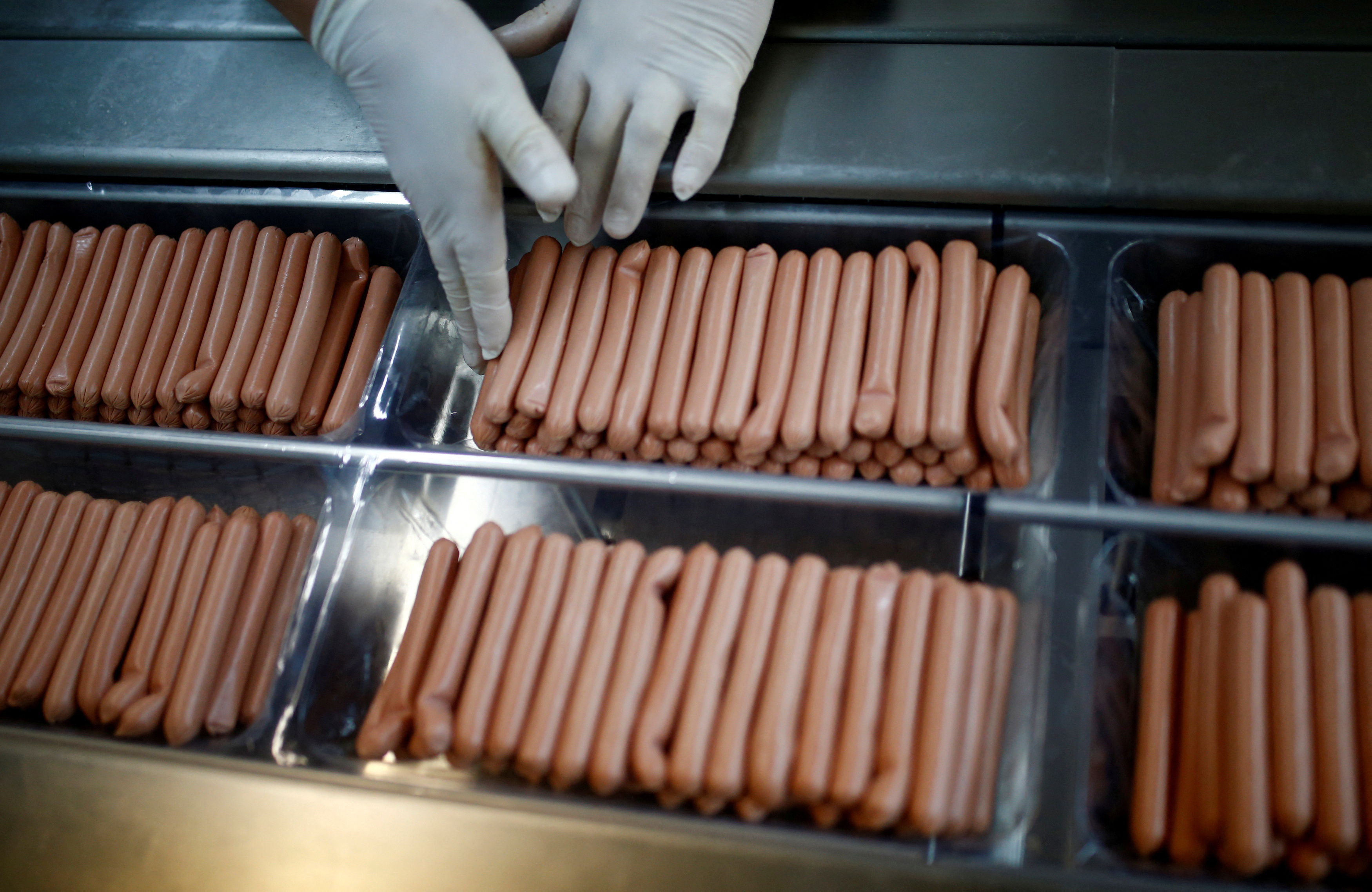 Workers work in sausages production section in Akova Impex Meat Industry Ovako in Sarajevo