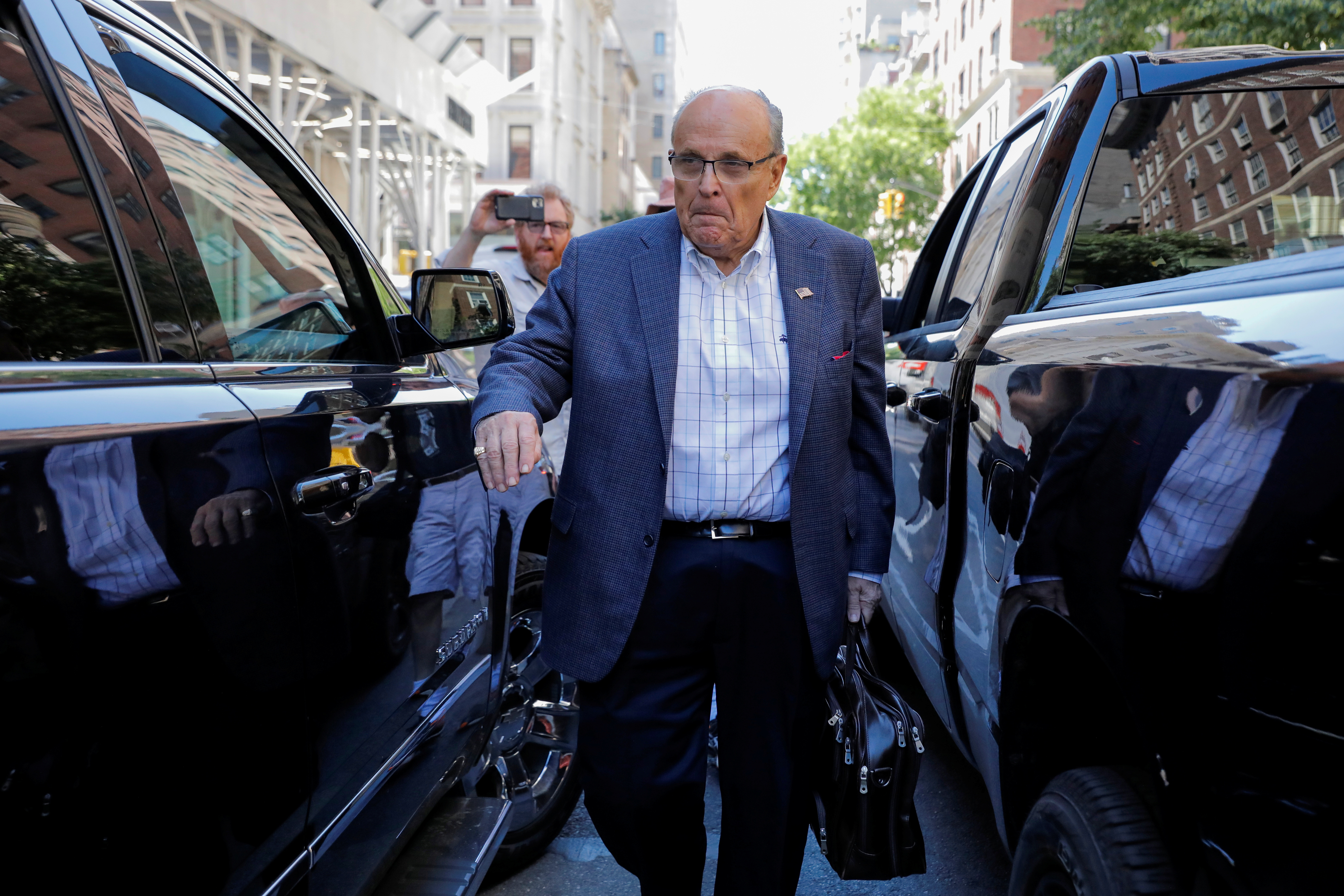 Former New York City Mayor Rudy Giuliani is seen outside his apartment building after his law license was suspended in Manhattan in New York City