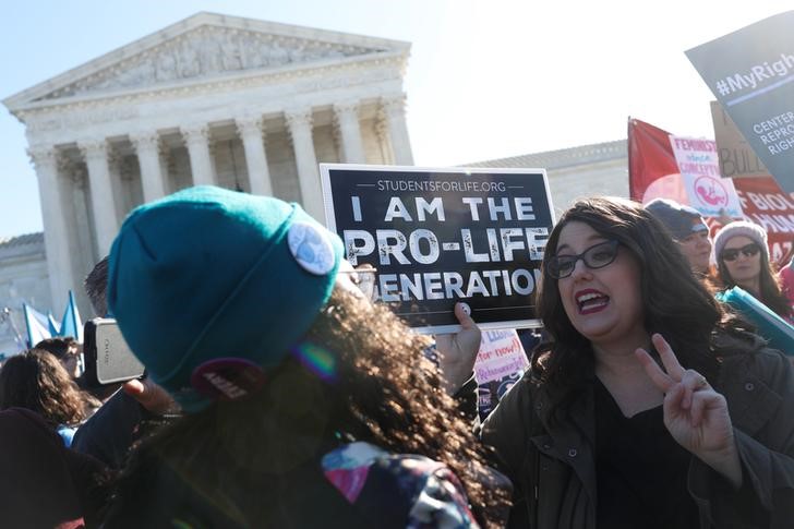 U.S. Supreme Court justices hear a major abortion case on the legality of a Republican-backed Louisiana law that imposes restrictions on abortion doctors, on Capitol Hill in Washington