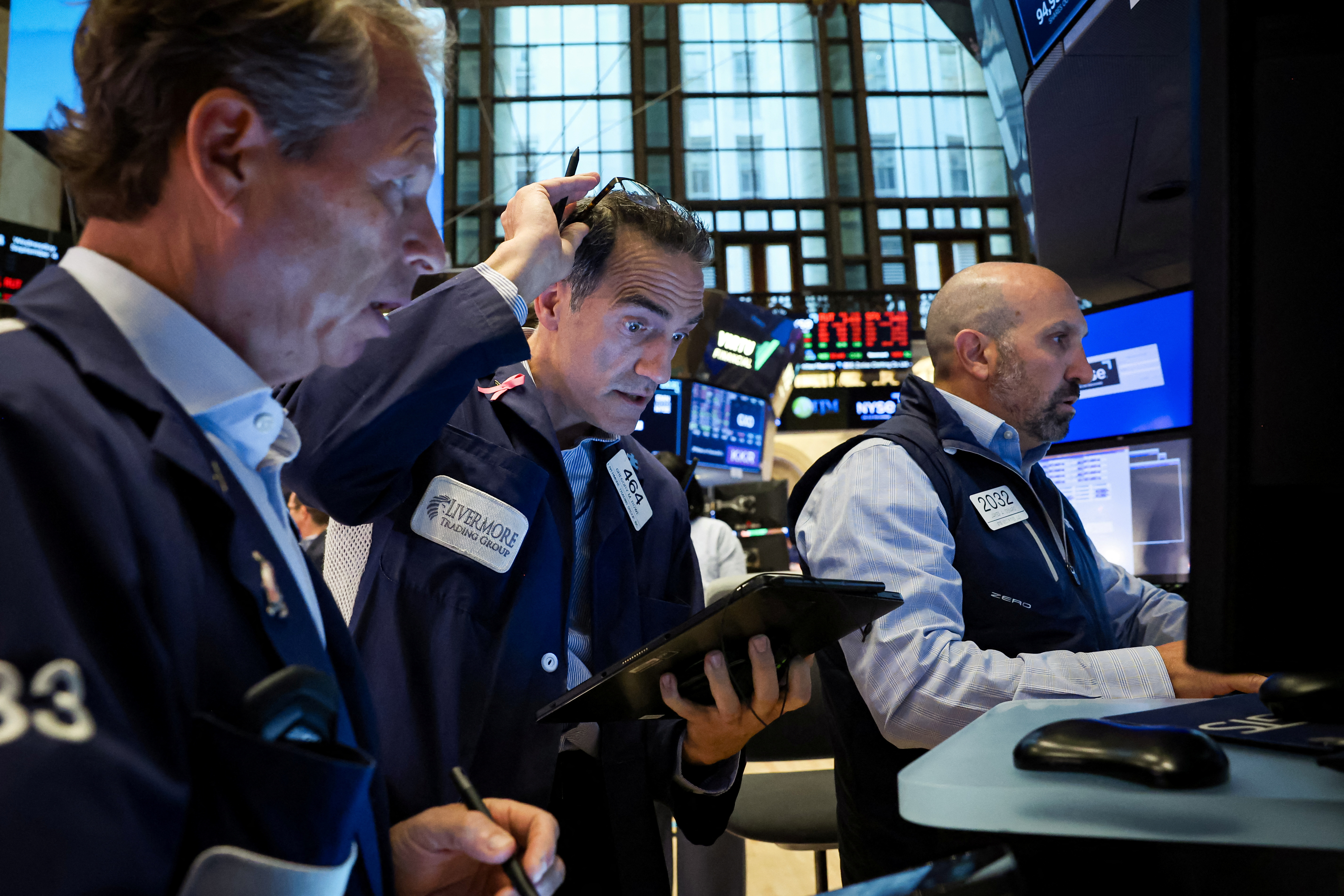 Traders work on the floor of the NYSE in New York