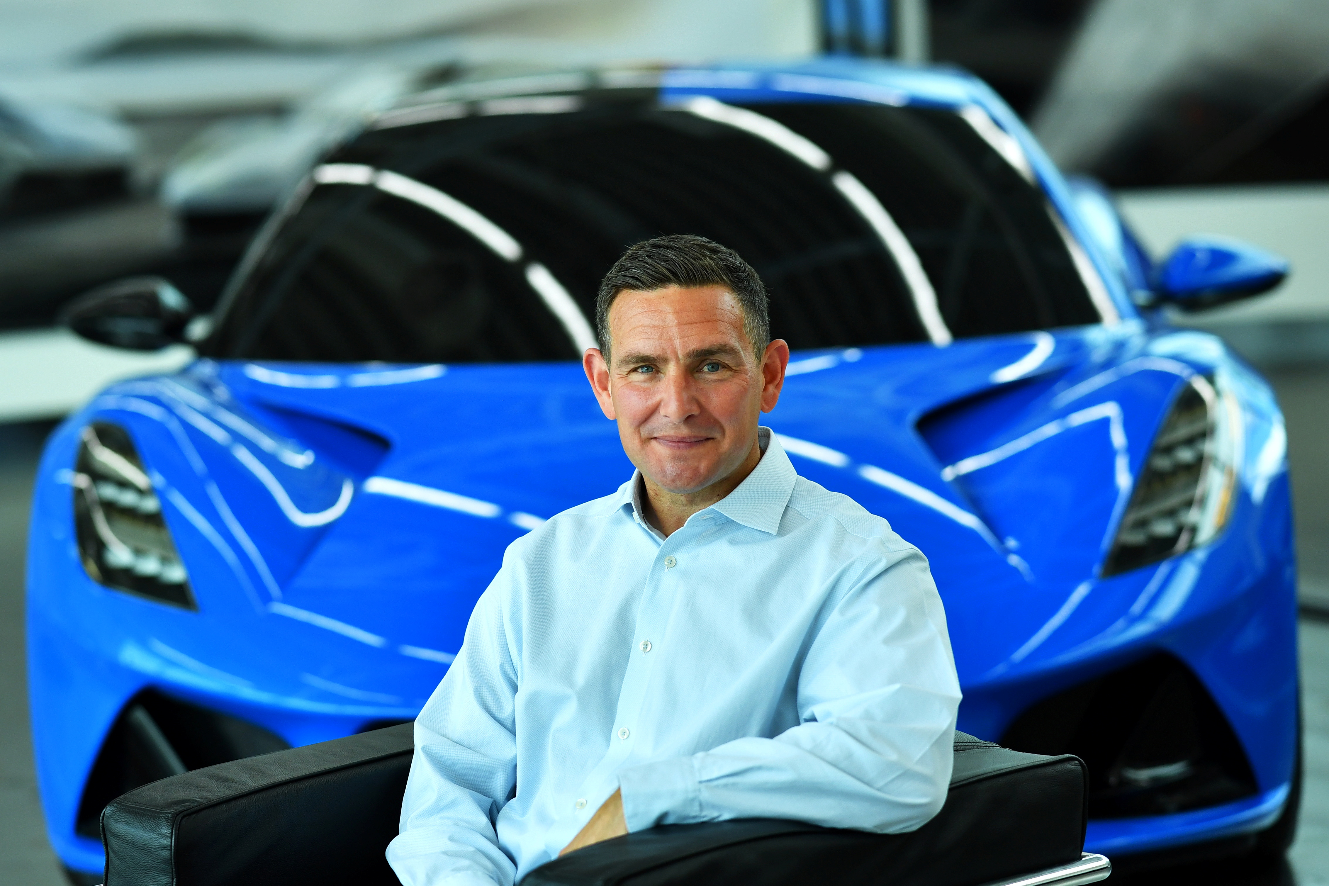 Managing Director of Lotus, Matt Windle sits in an Emira car at the company's plant in Hethel
