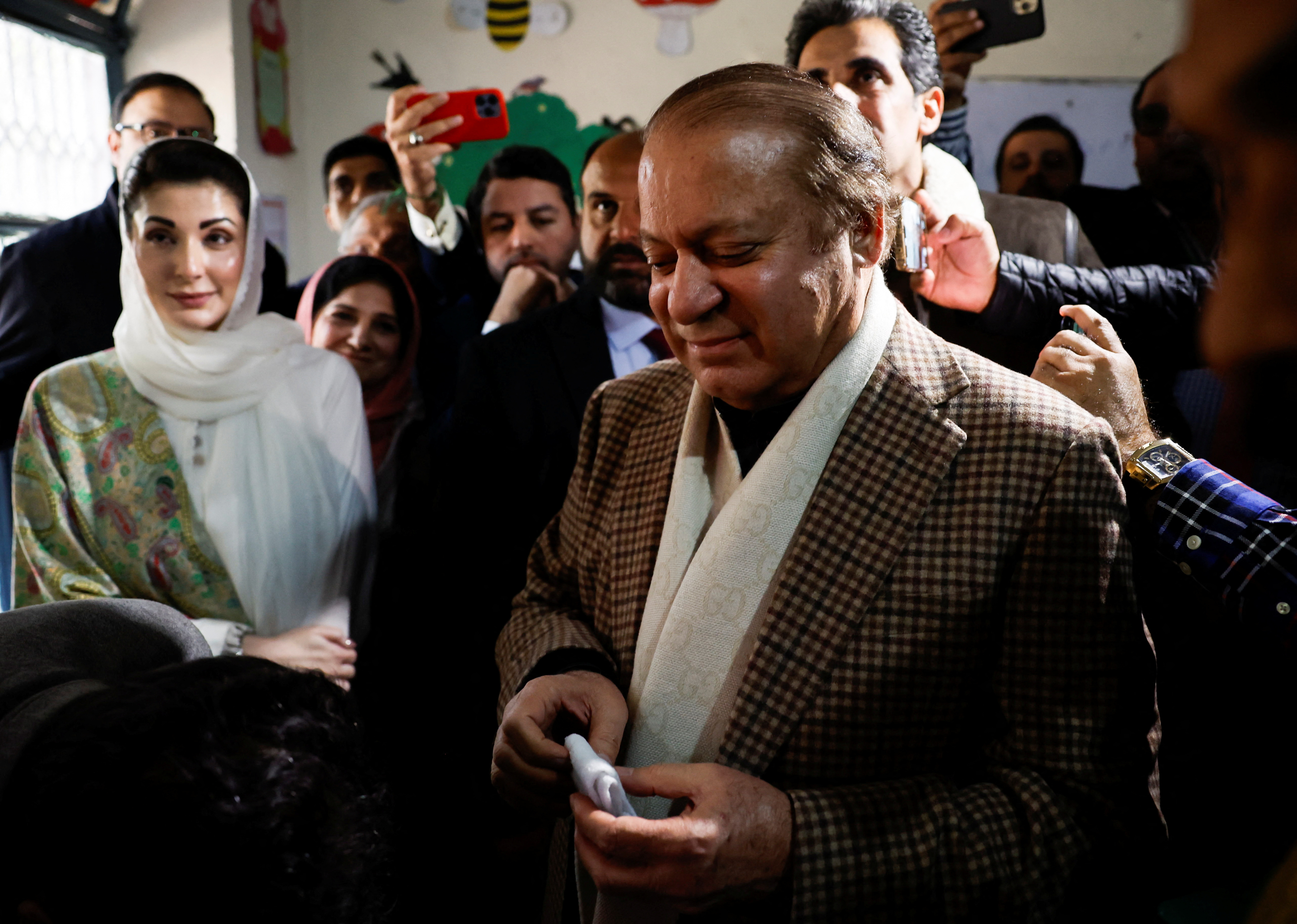 Former Prime Minister Nawaz Sharif votes during the general election in Lahore