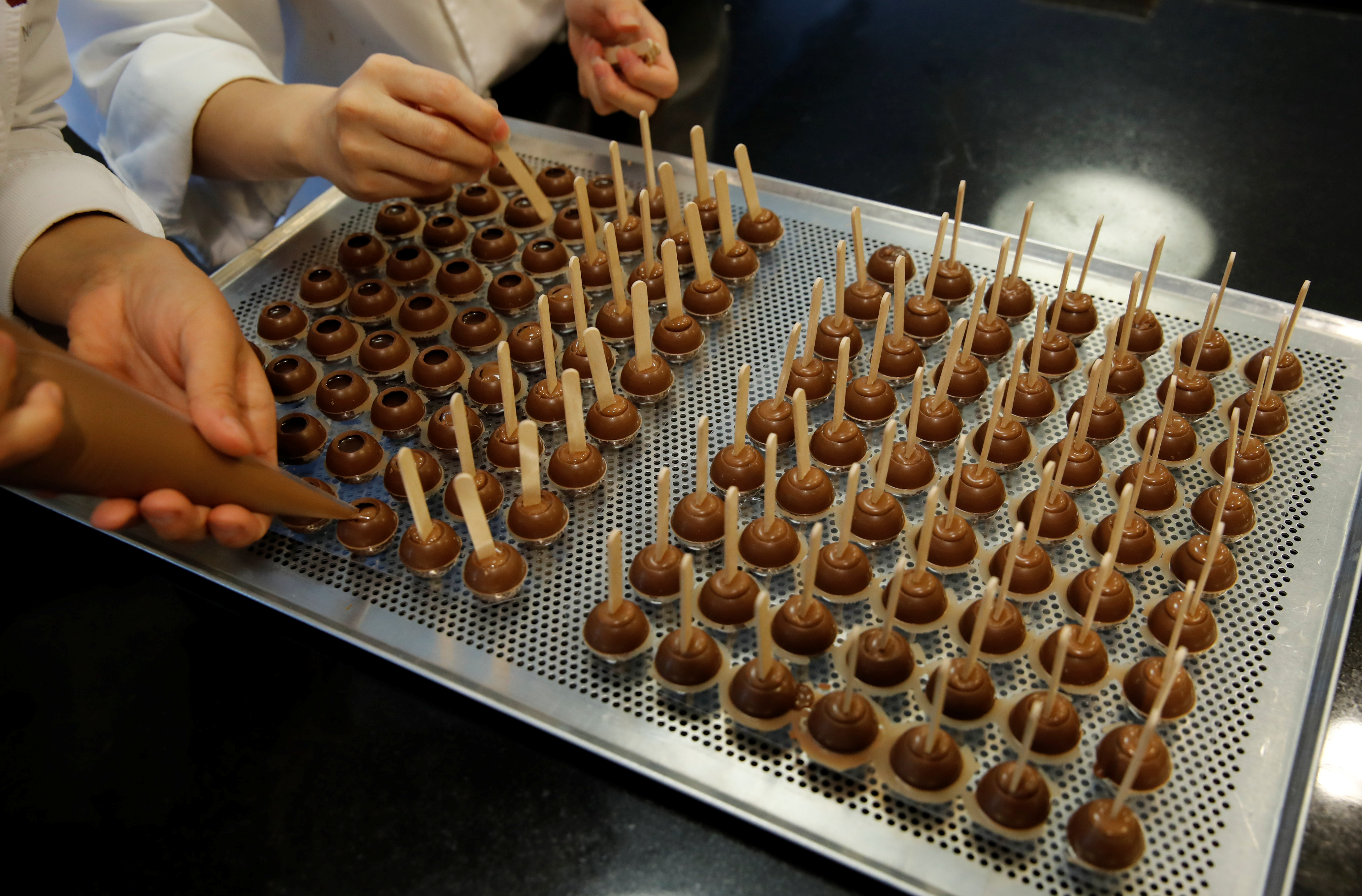 Empoyees of chocolate and cocoa product maker Barry Callebaut prepare chocolates in Zurich