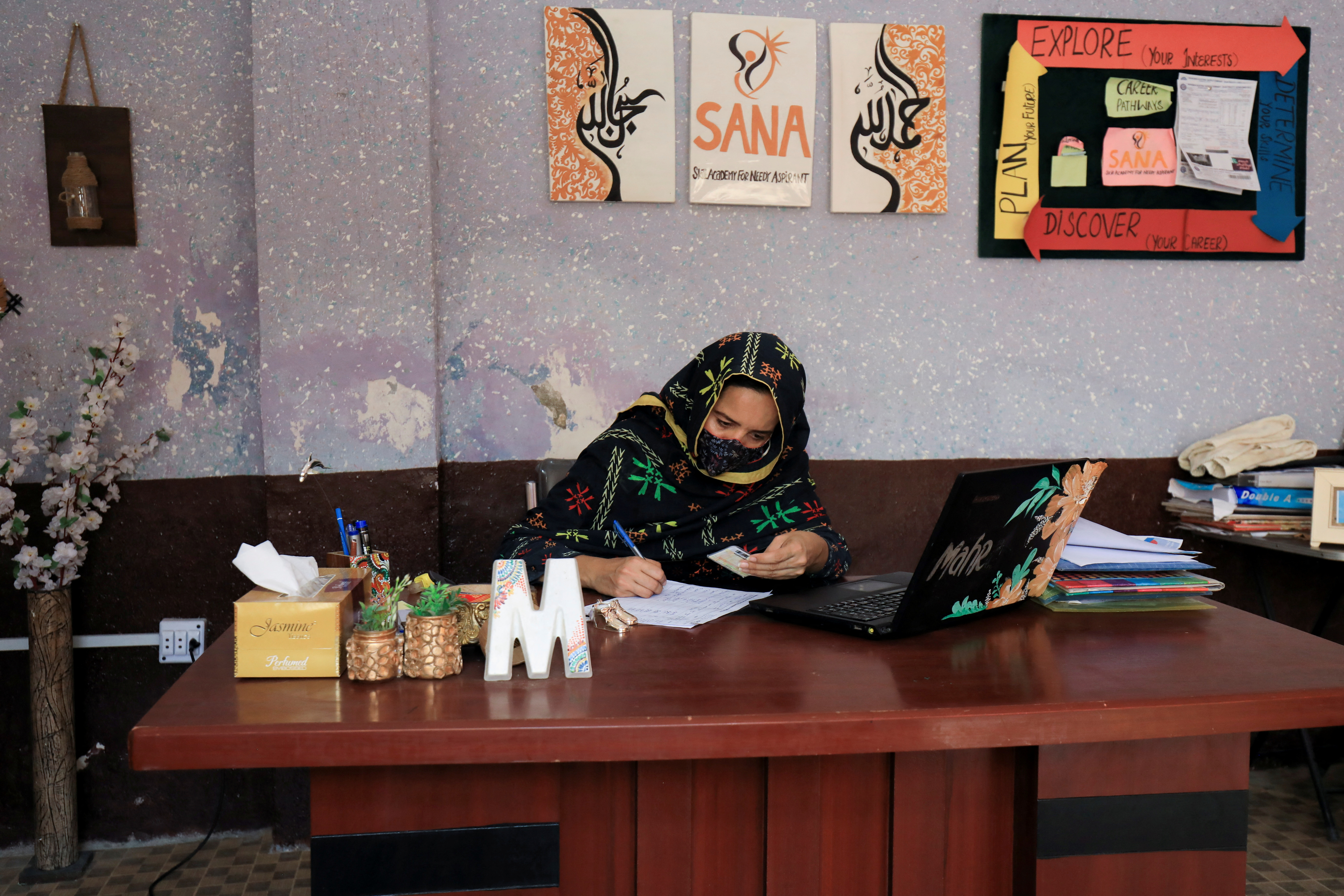 Mahra Bashir, chief executive of the Skills Academy for Needy Aspirants, work at her office in Peshawar