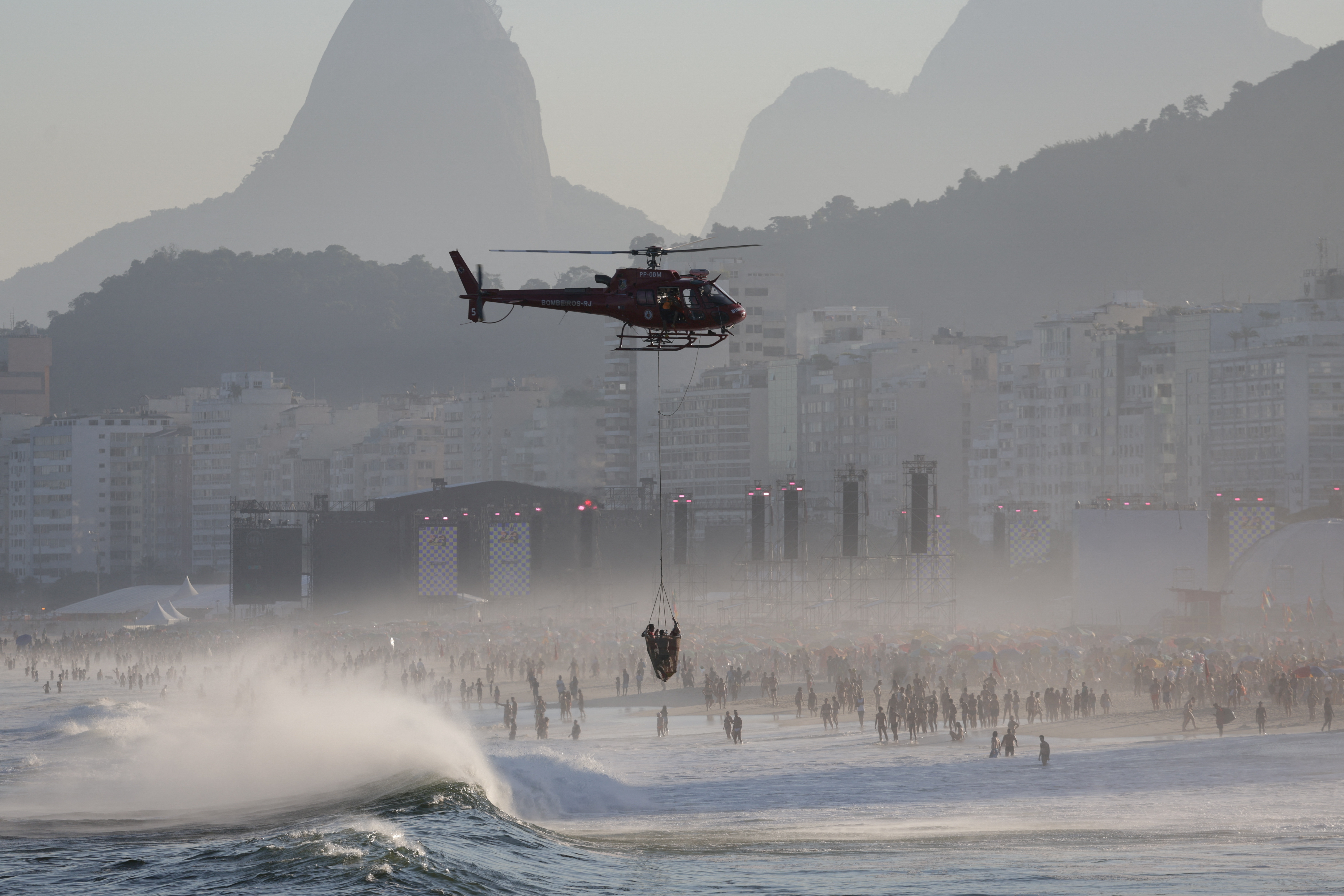People gather for Madonna's concert at Copacabana beach, in Rio de Janeiro