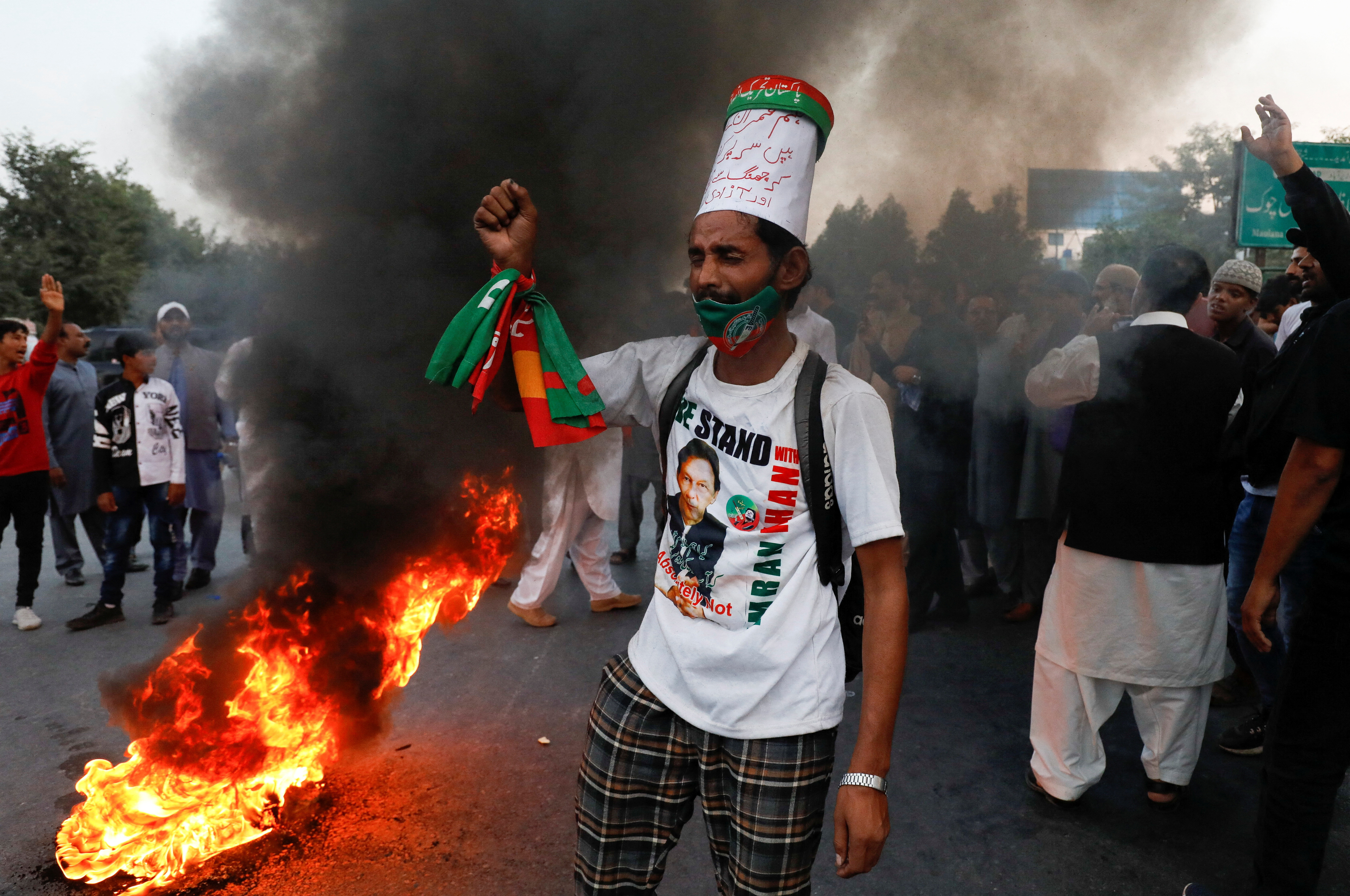 People protest following the shooting incident on a long march held by Pakistan's former Prime Minister Imran Khan, in Wazirabad