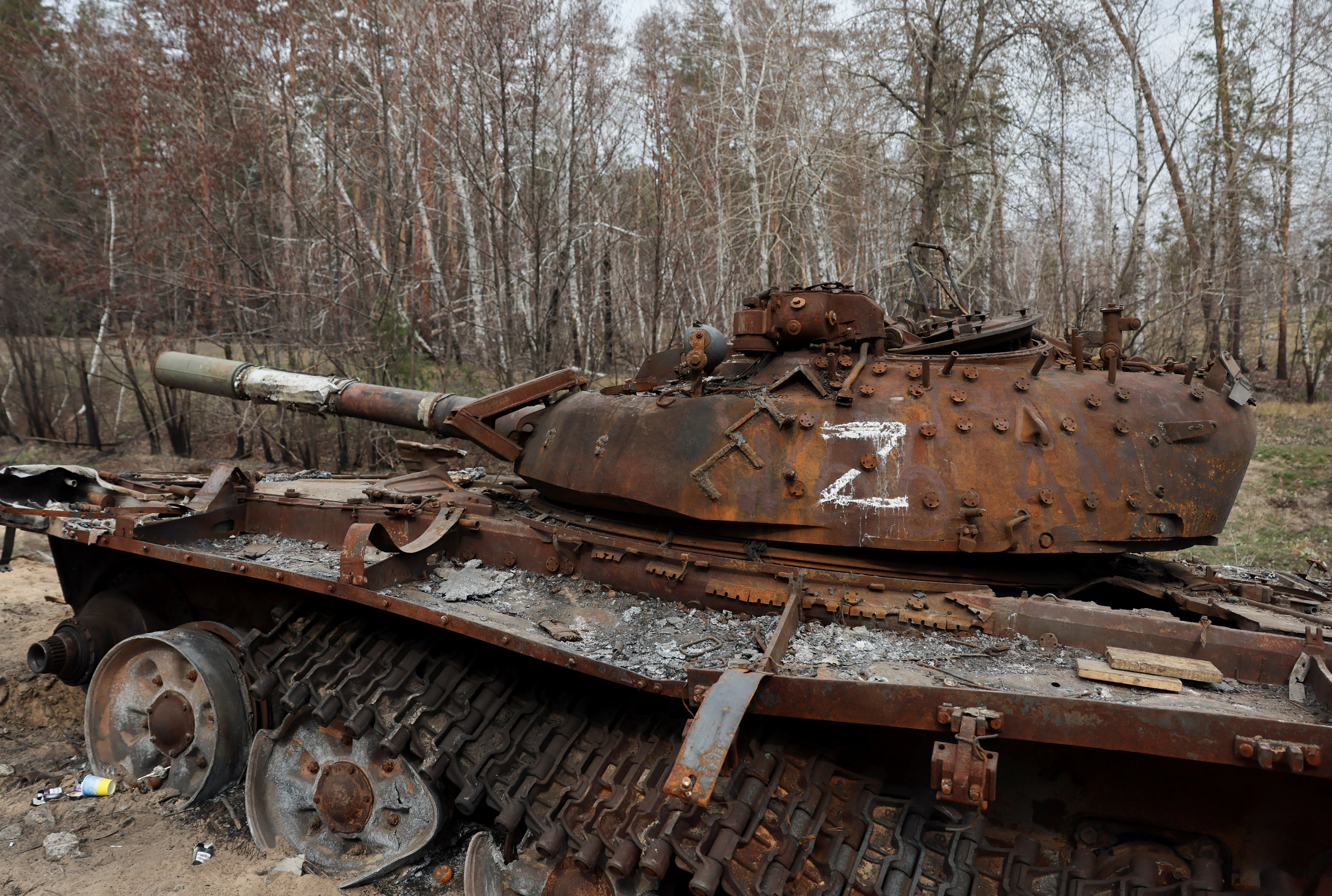 Destroyed Russian tank remains on the side of the road near the frontline town of Kreminna