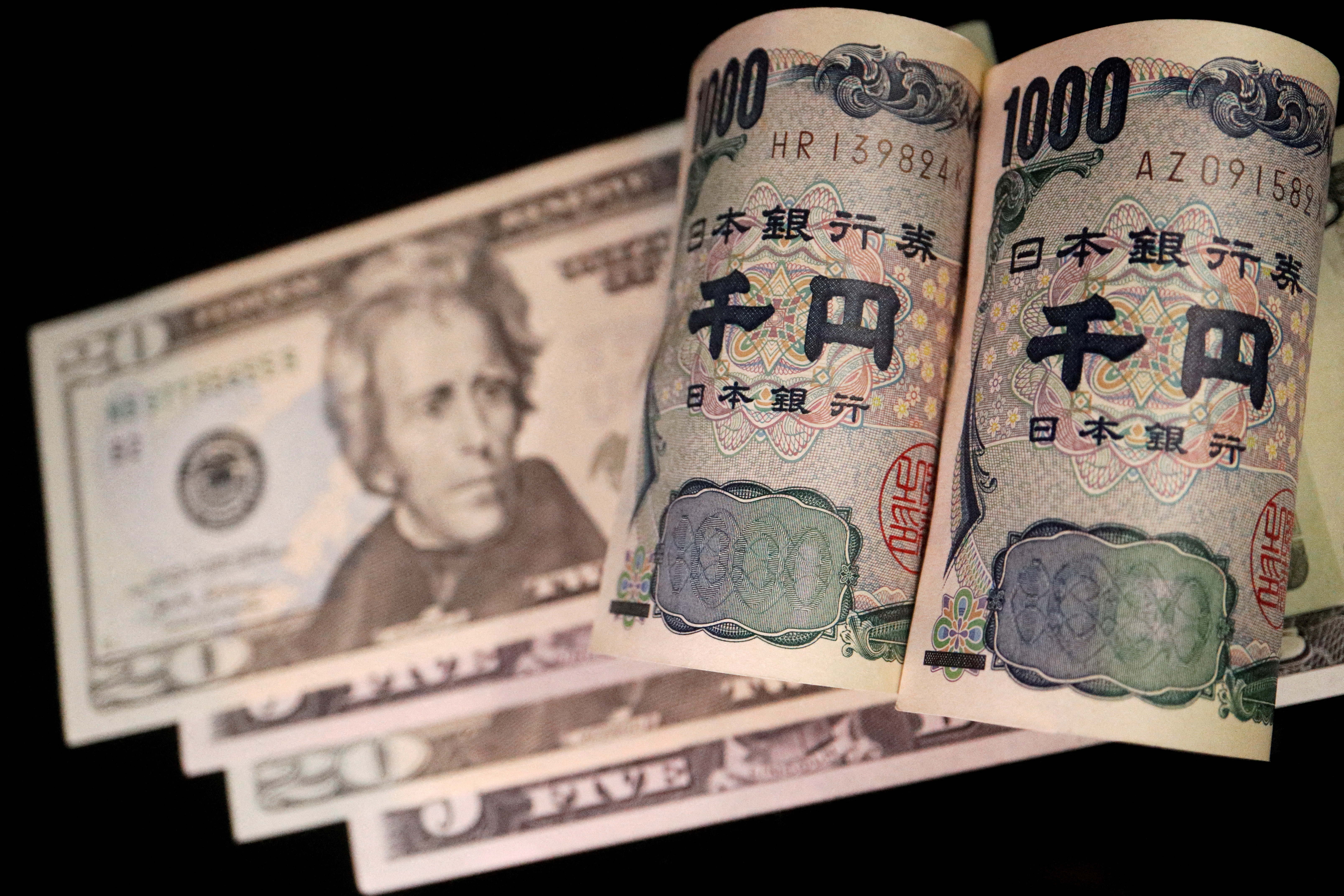  Illustration picture of Japanese yen and U.S. dollar banknotes