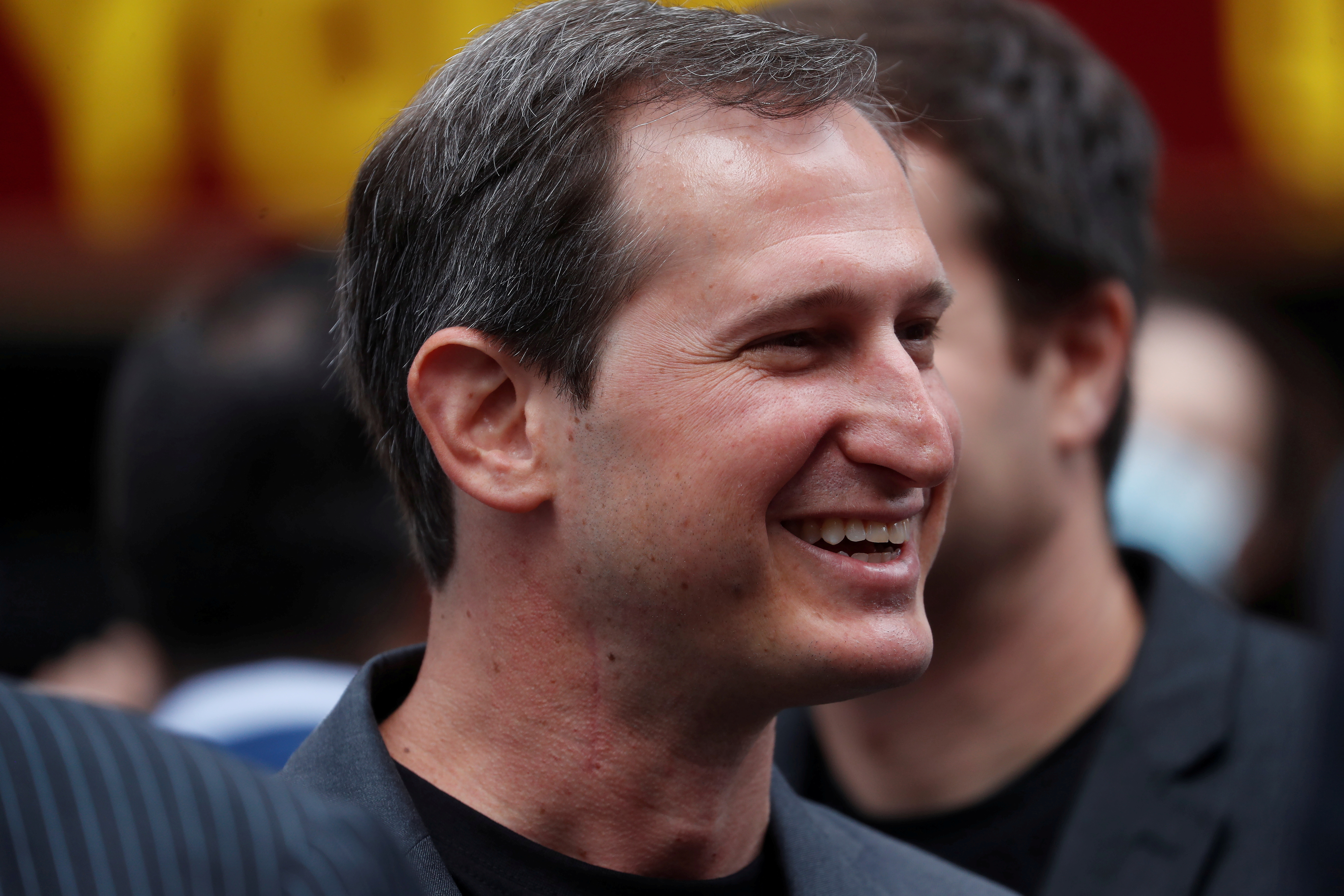 Jason Robins, CEO of DraftKings, smiles after the company's initial public offering (IPO) listing, outside the Nasdaq MarketSite, in New York City