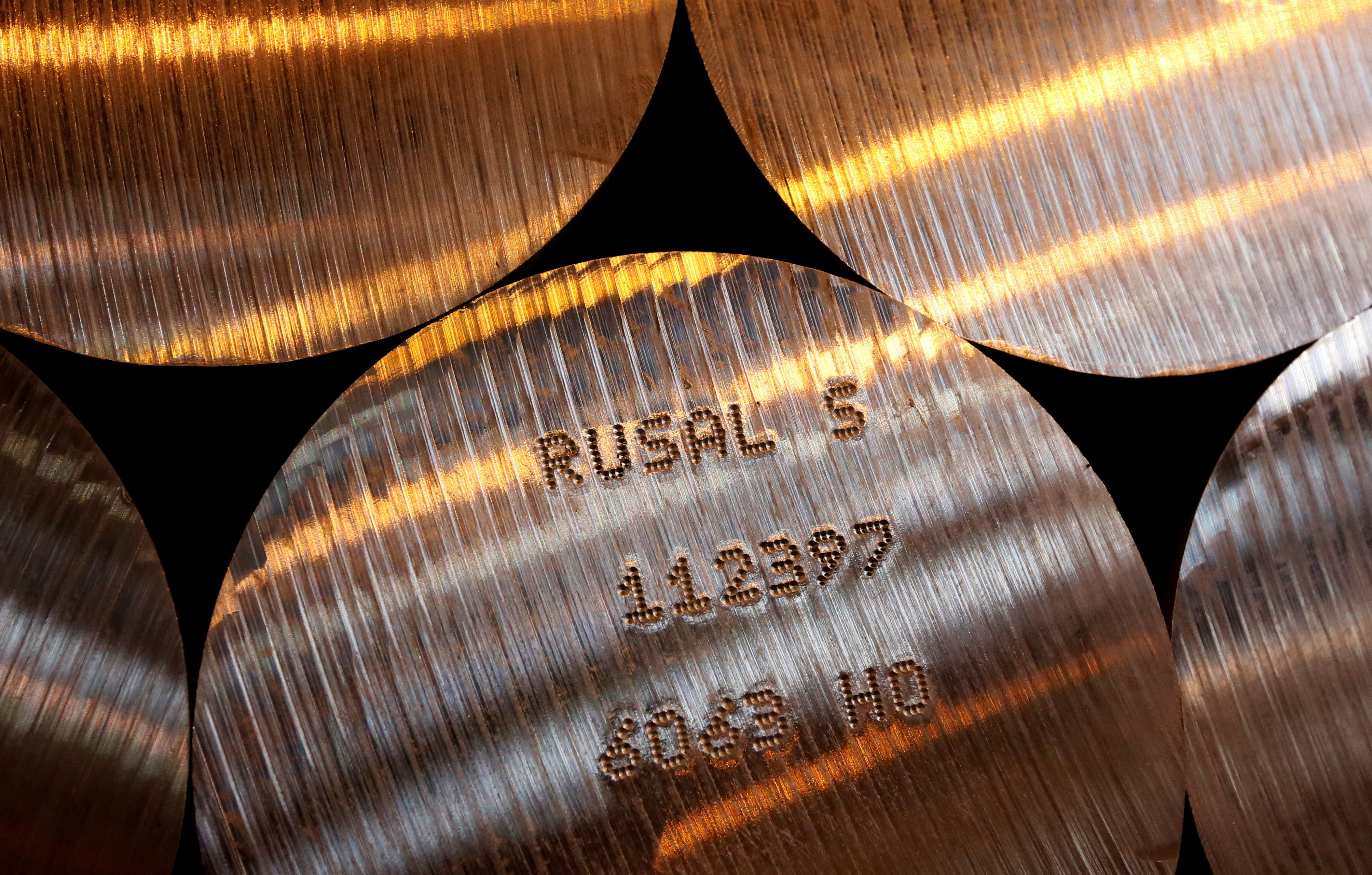 Marked cylindrical aluminium ingots at the foundry shop of the Rusal Sayanogorsk aluminium smelter