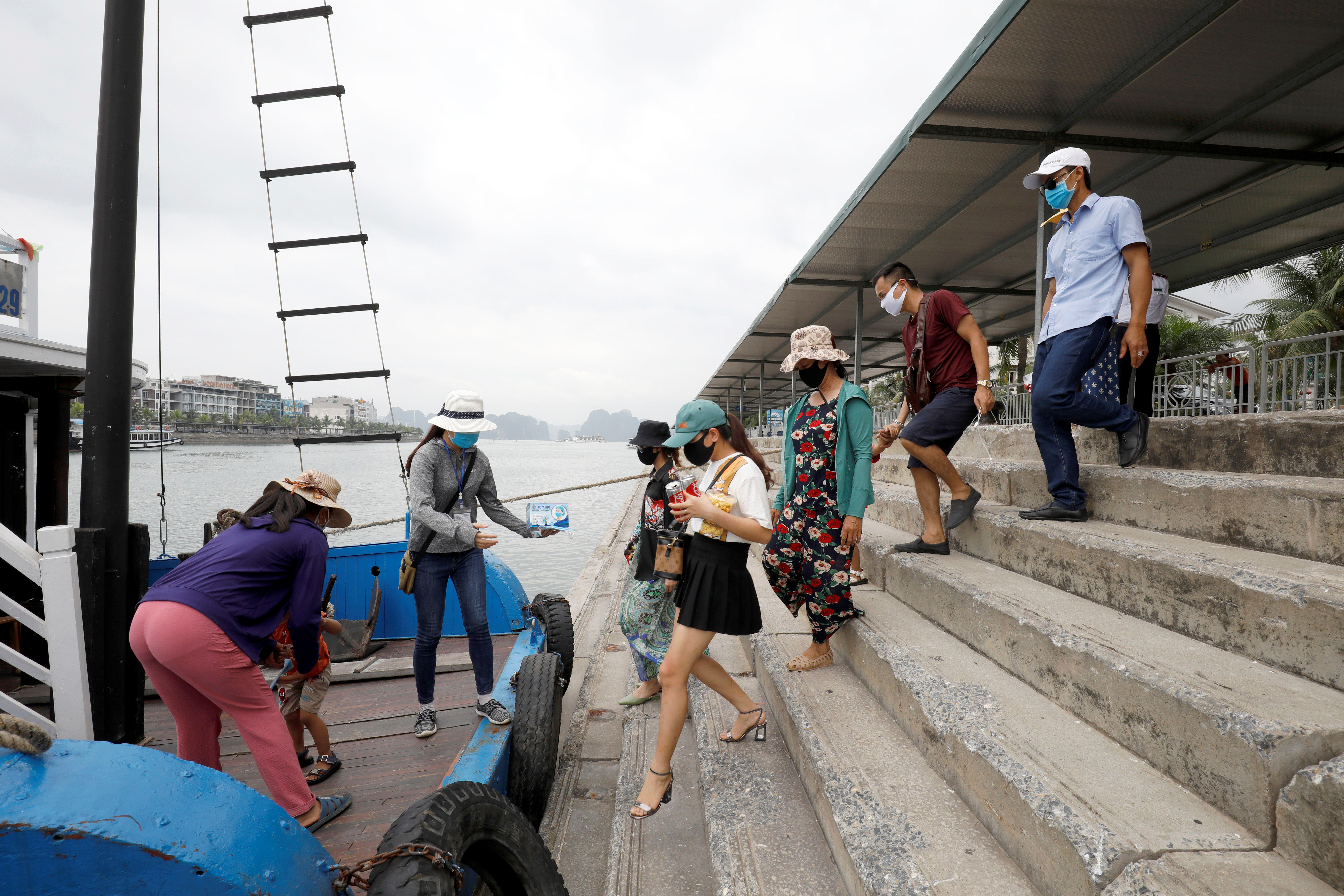 Vietnamese tourists visit Ha Long bay after the Vietnamese government eased the lockdown following the coronavirus disease (COVID-19) outbreak, in Quang Ninh province