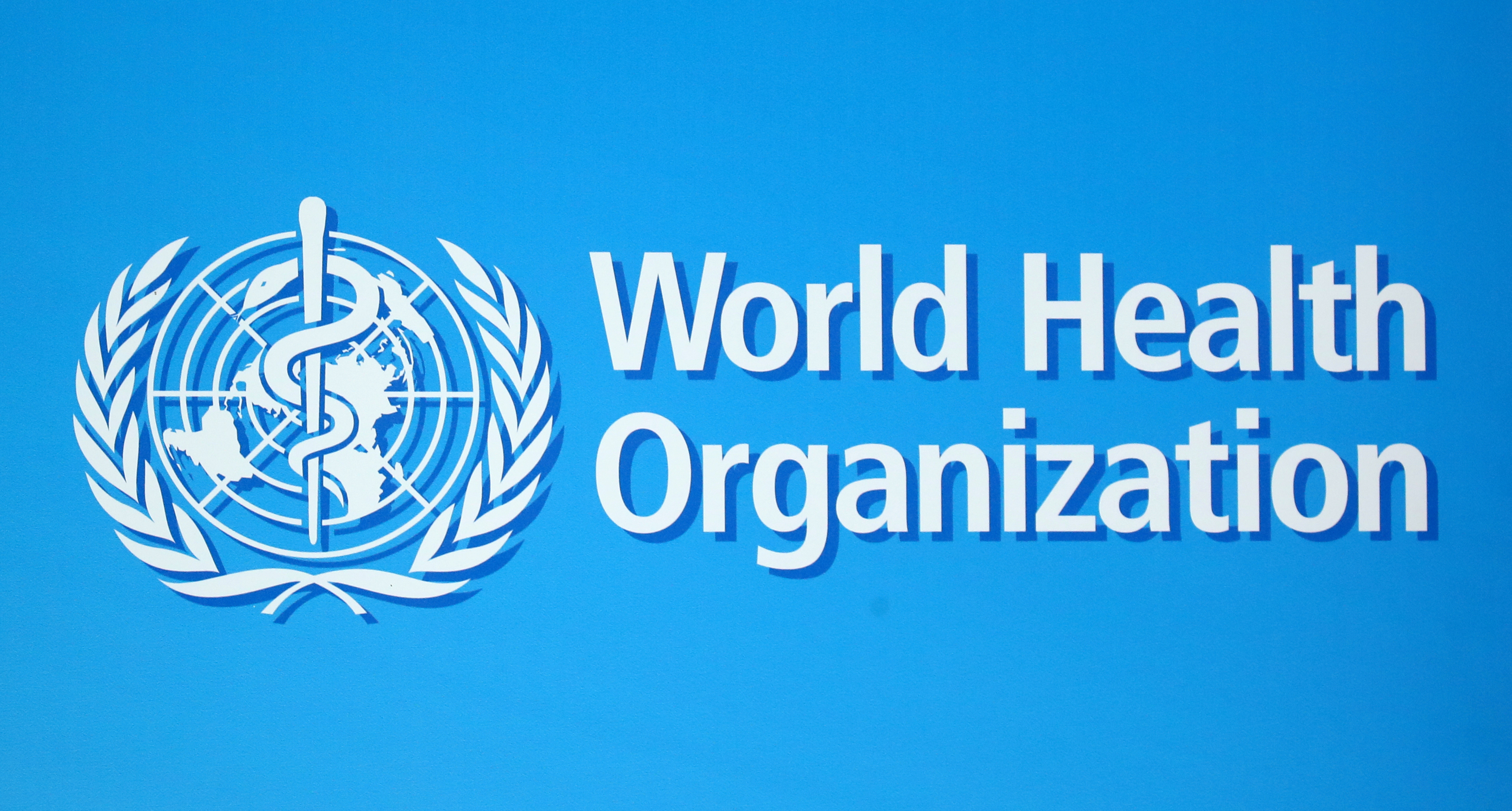 A logo of the World Health Organization (WHO), is seen before a news conference in Geneva