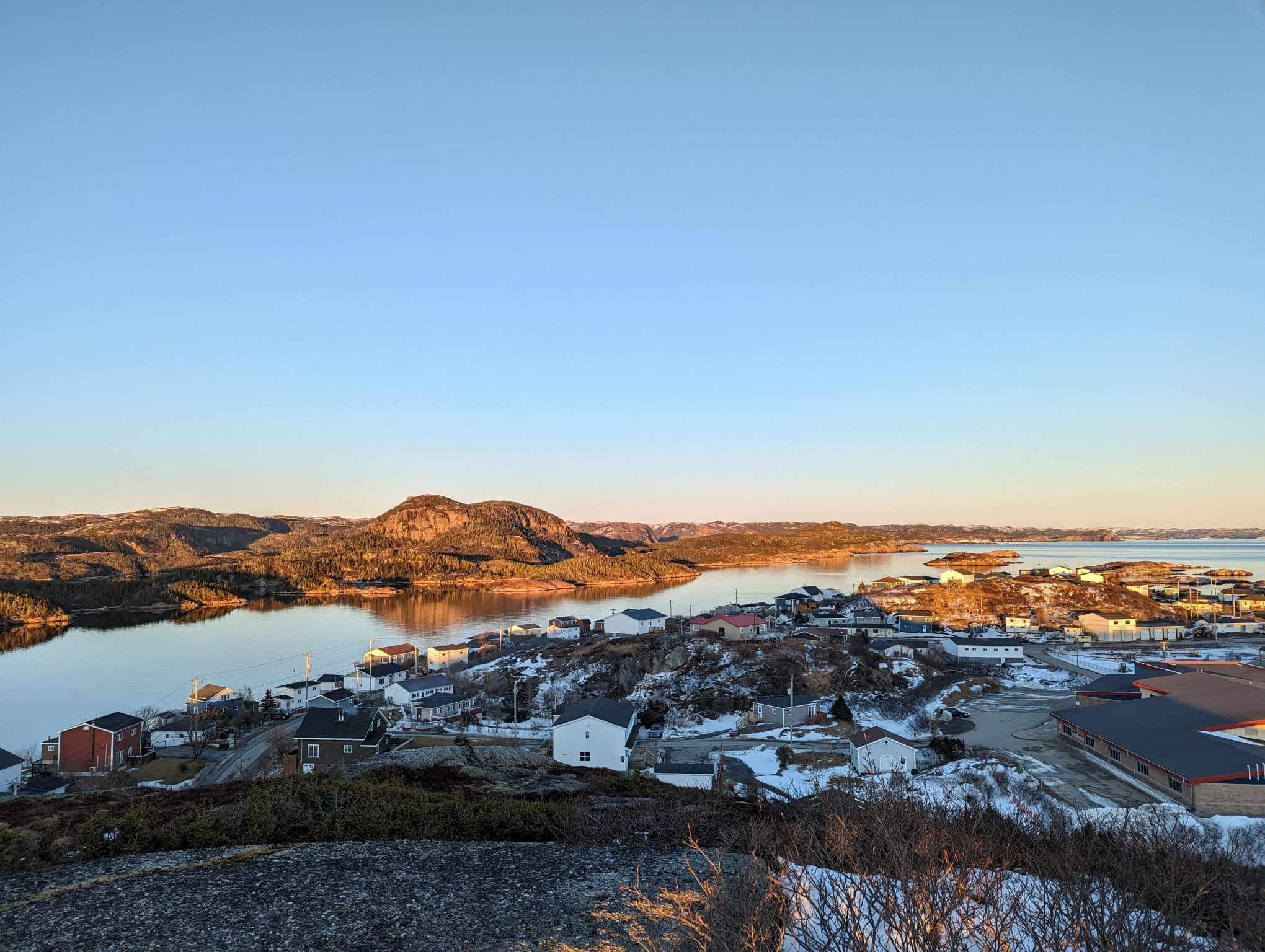 A view from the top of Maiden Tea Hill overlooks the seaside town of Burgeo and Eclipse Island