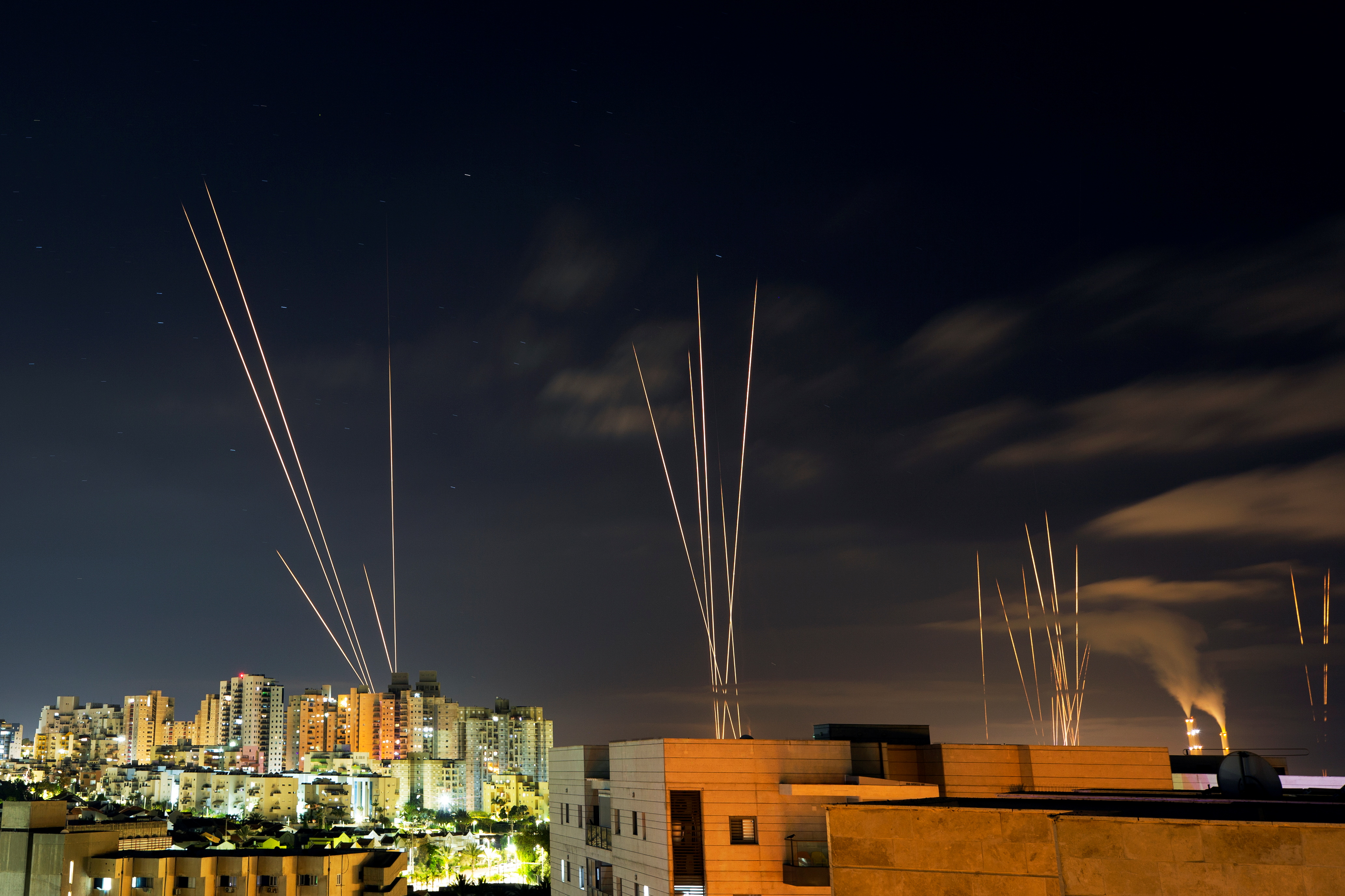 Streaks of light are seen as rockets are launched from the Gaza Strip towards central Israel as seen from Ashkelon, Israel May 16, 2021 REUTERS/Amir Cohen