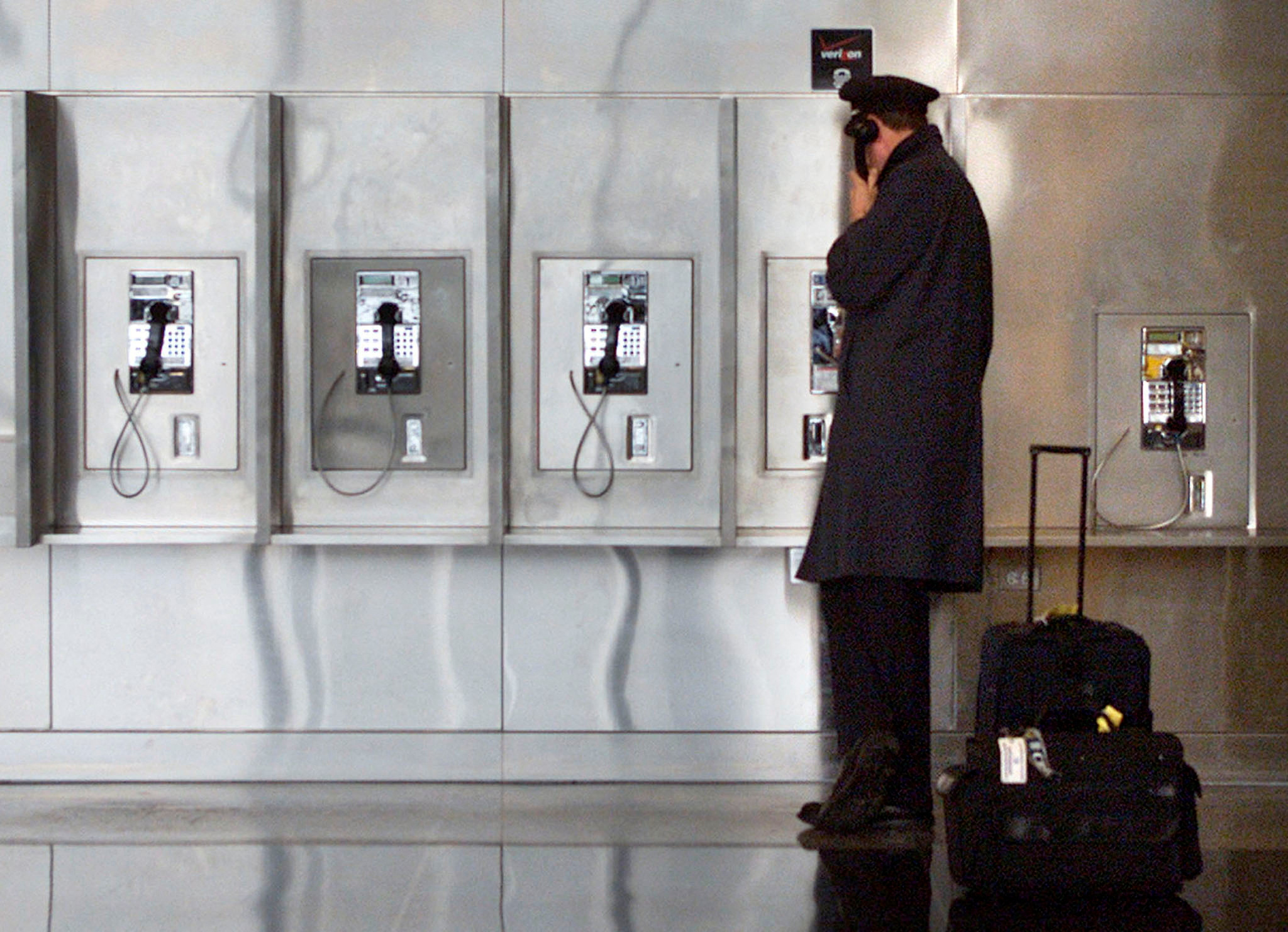 A PILOT TALKS ON THE PHONE AT REAGAN NATIONAL AIRPORT NEAR WASHINGTON.