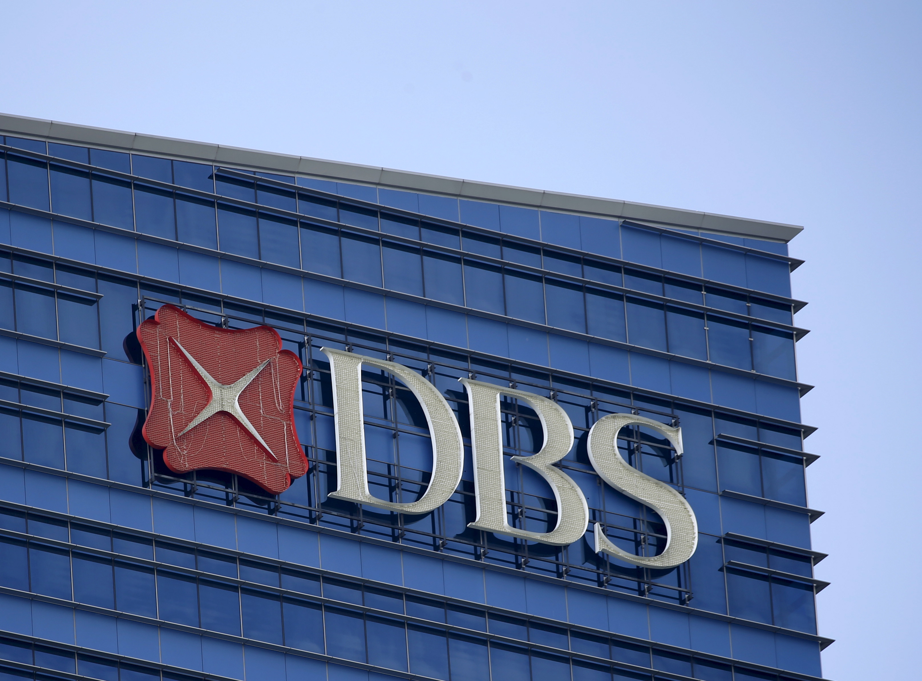 A DBS logo on their office building in Singapore, February 22, 2016. DBS Group Holdings, Singapore's biggest lender, posted a 20 percent rise in quarterly profit that beat expectations, as its net interest margin rose to a five-year high. REUTERS/Edgar Su