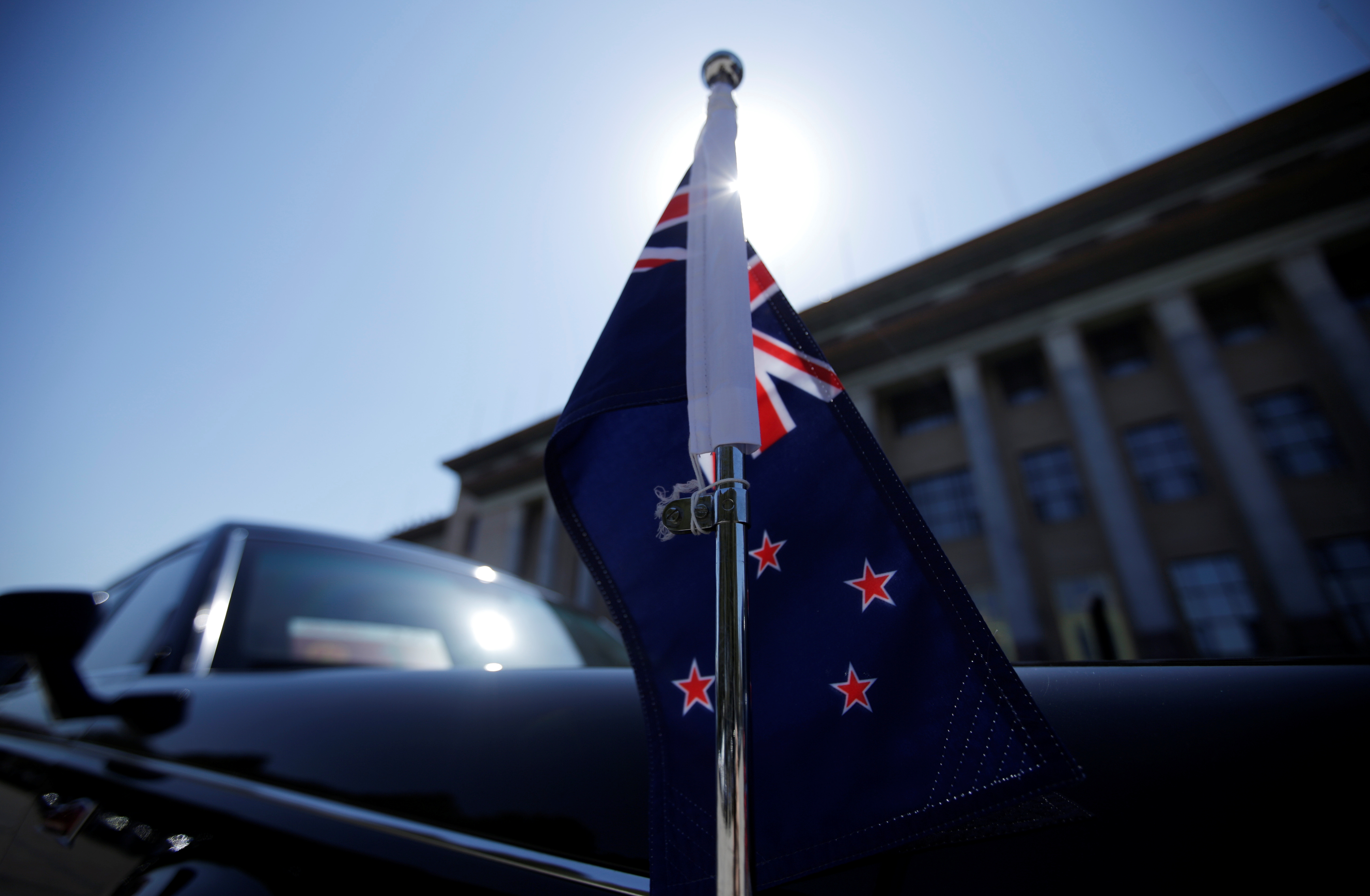 A car with a New Zealand flag waits for New Zealand Prime Minister Jacinda Ardern in Beijing
