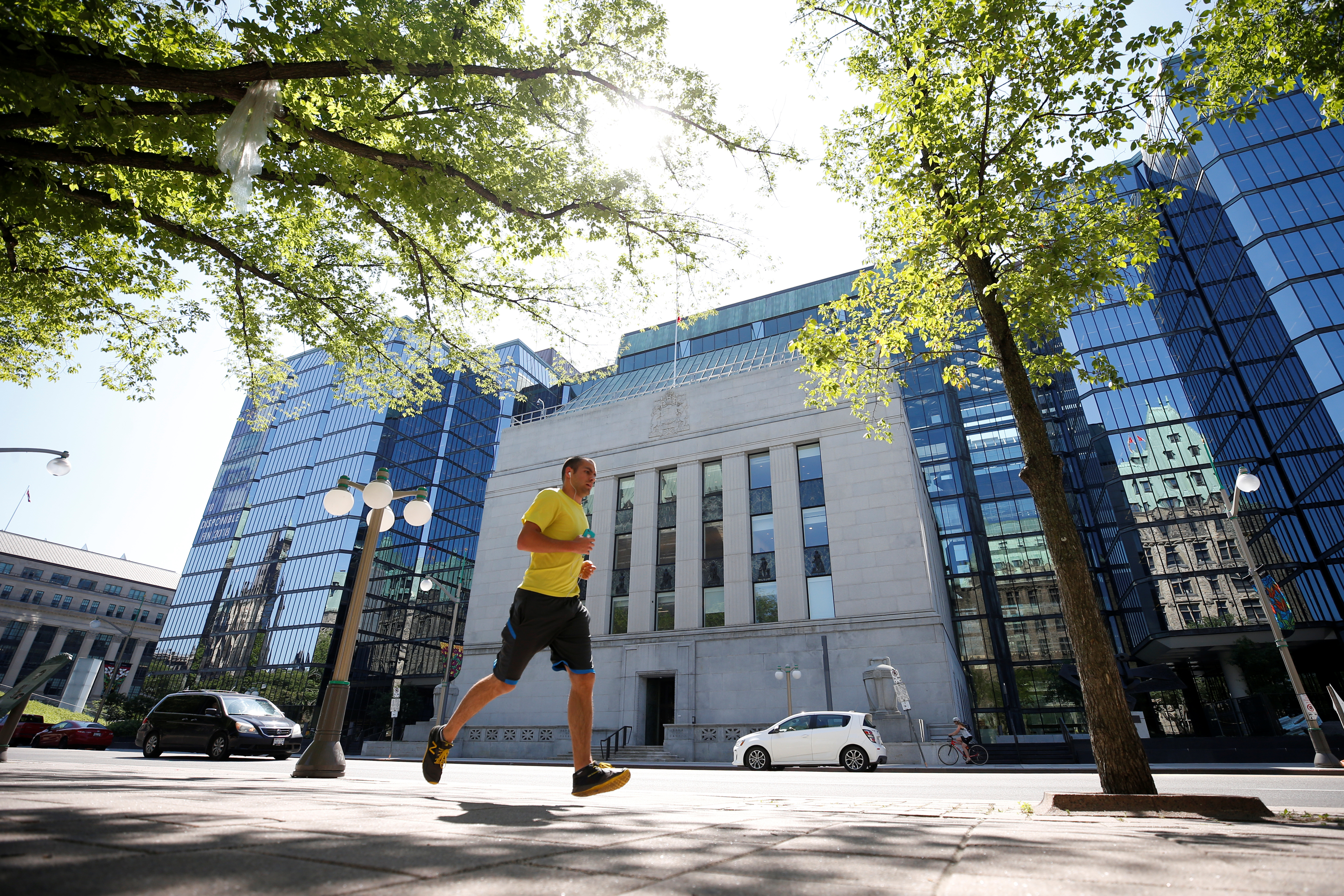 A jogger runs past the Bank of Canada building in Ottawa