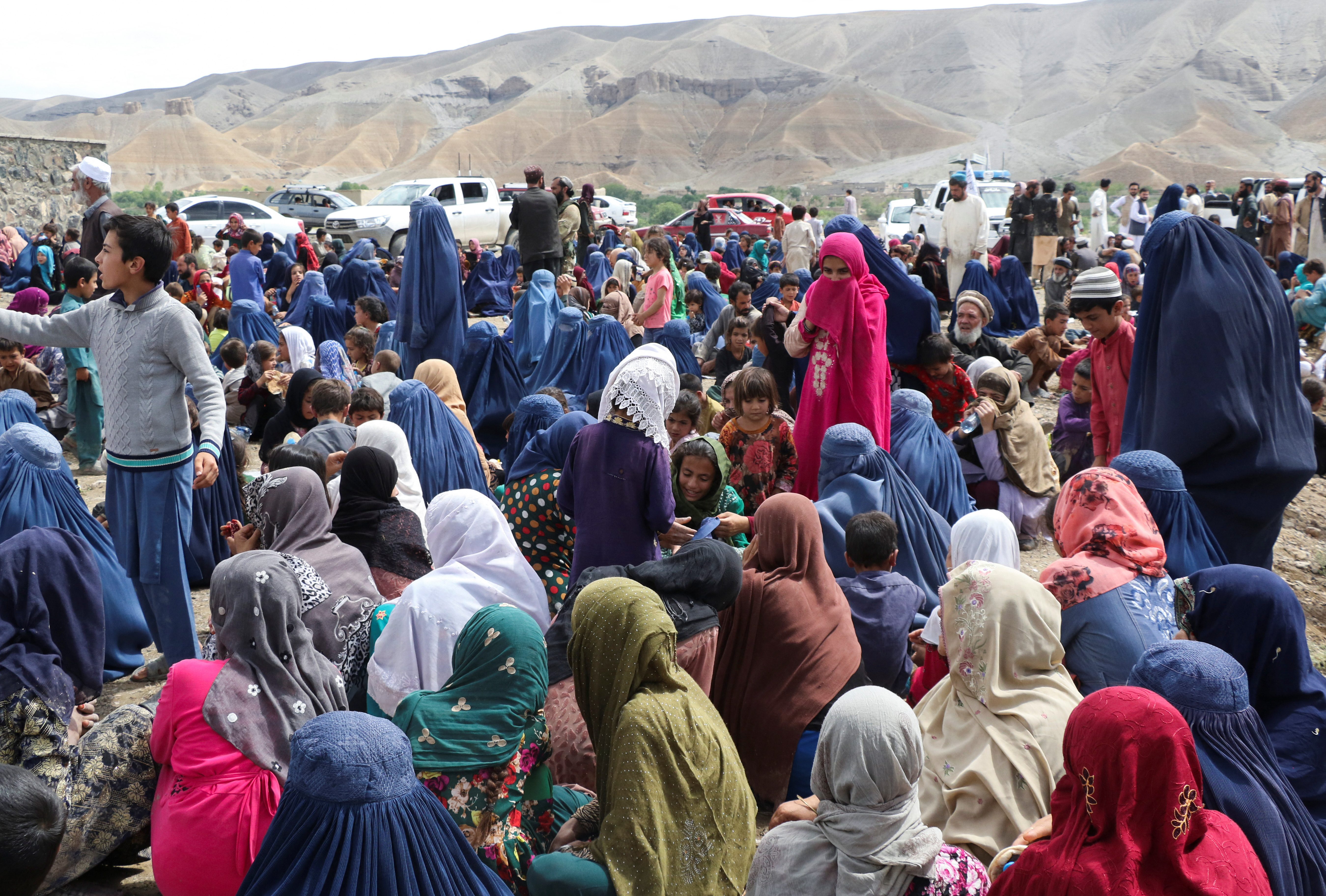 Displaced Afghan families spend time together after the heavy flood in the Khushi district of Logar