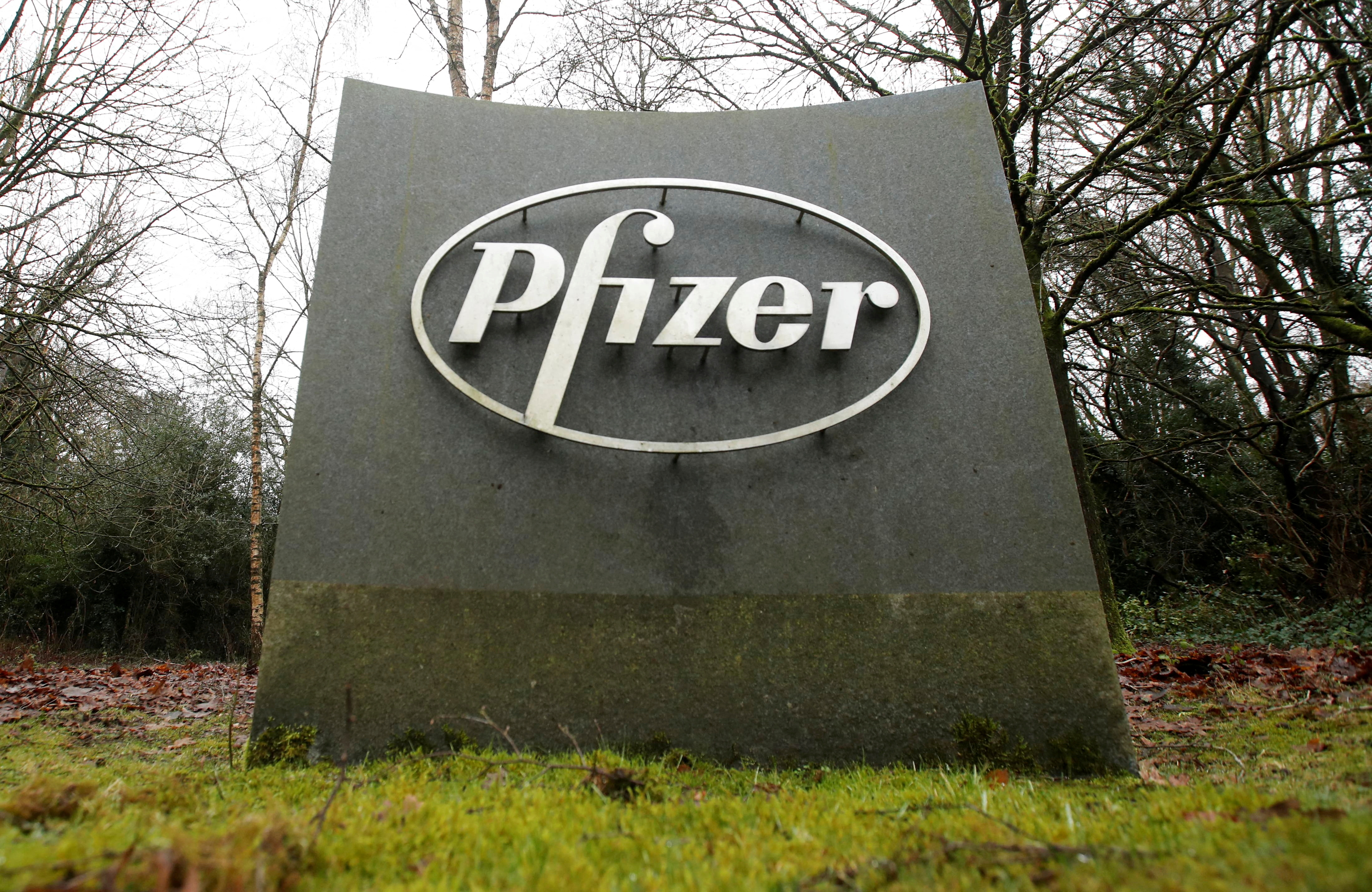 The Pfizer logo is seen at their UK commercial headquarters in Walton Oaks