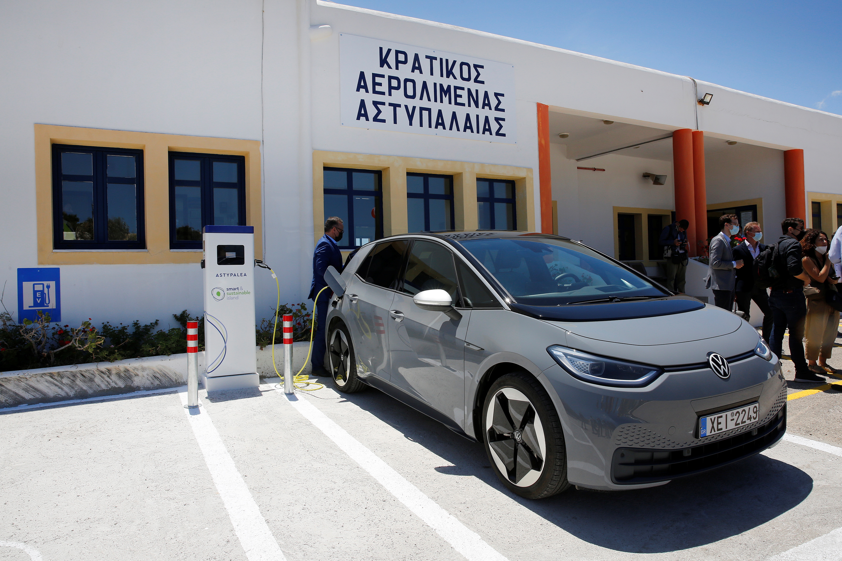 Charging a Volkswagen ID.4 electric car at the airport on the island of Astypalea
