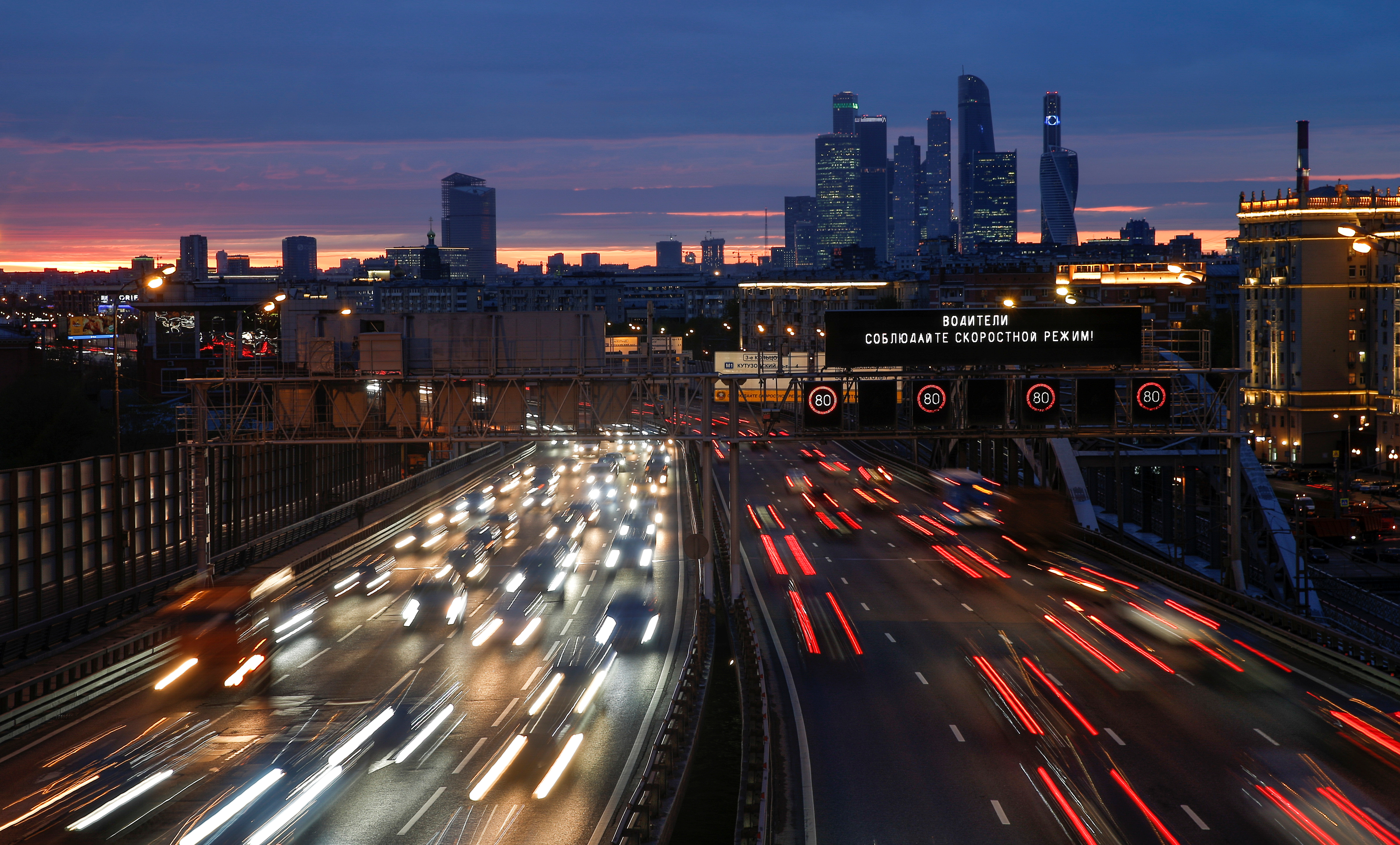 Cars drive along a highway in Moscow.