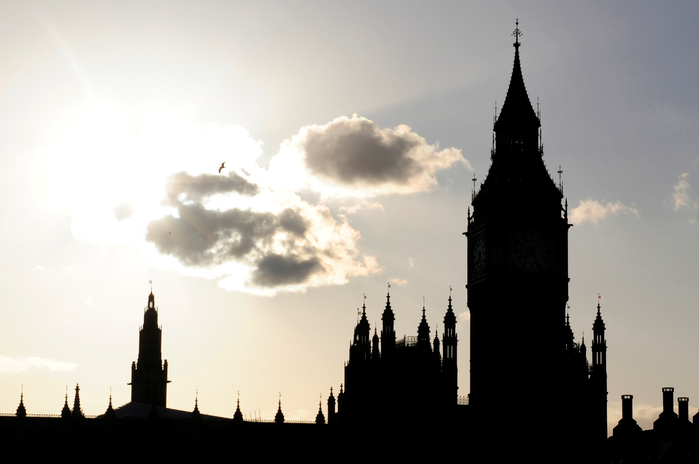 The sun sets behind Britain's House of Commons and Big Ben in central London