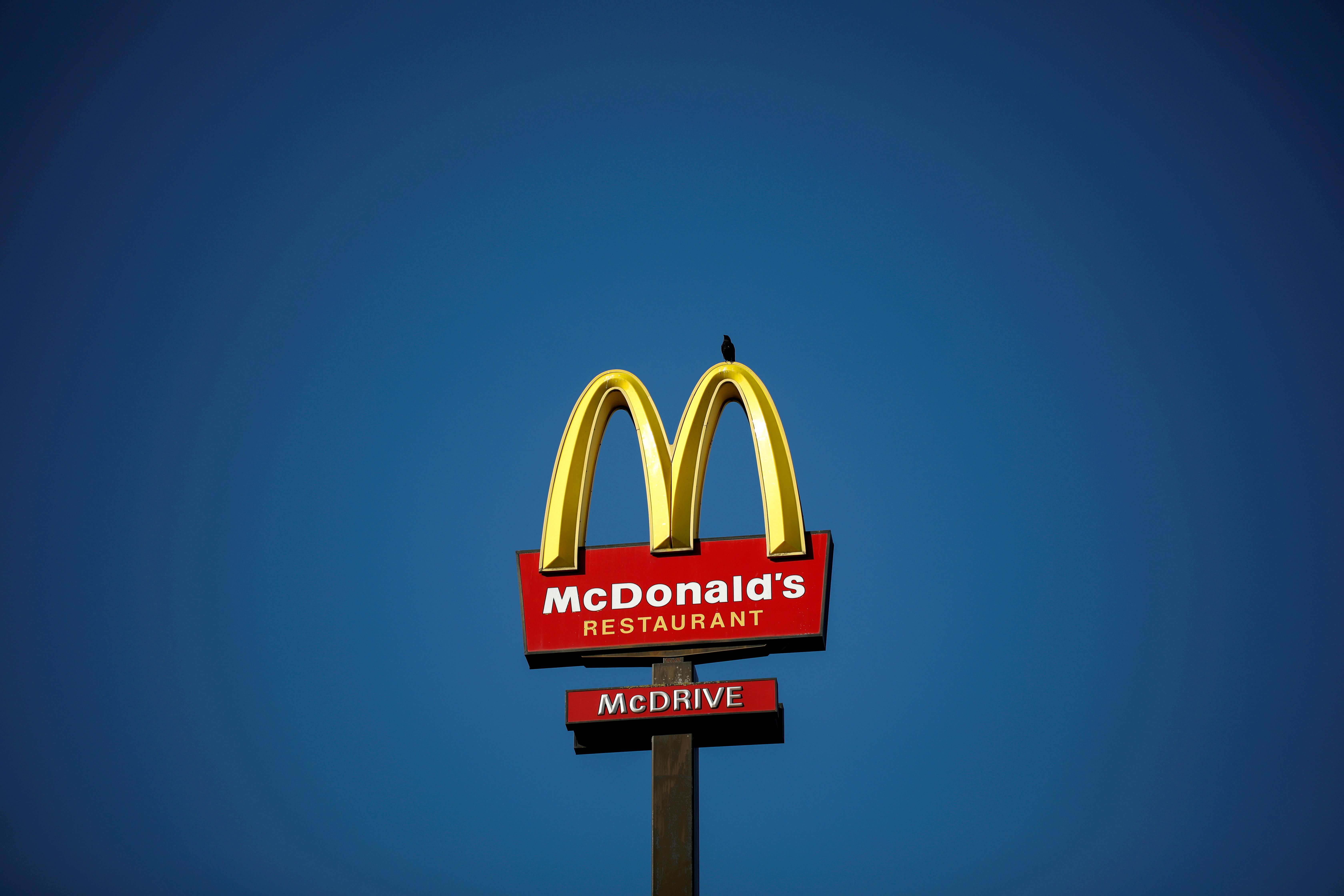 The McDonald's company logo stands on a sign outside a restaurant in Bretigny-sur-Orge, near Paris