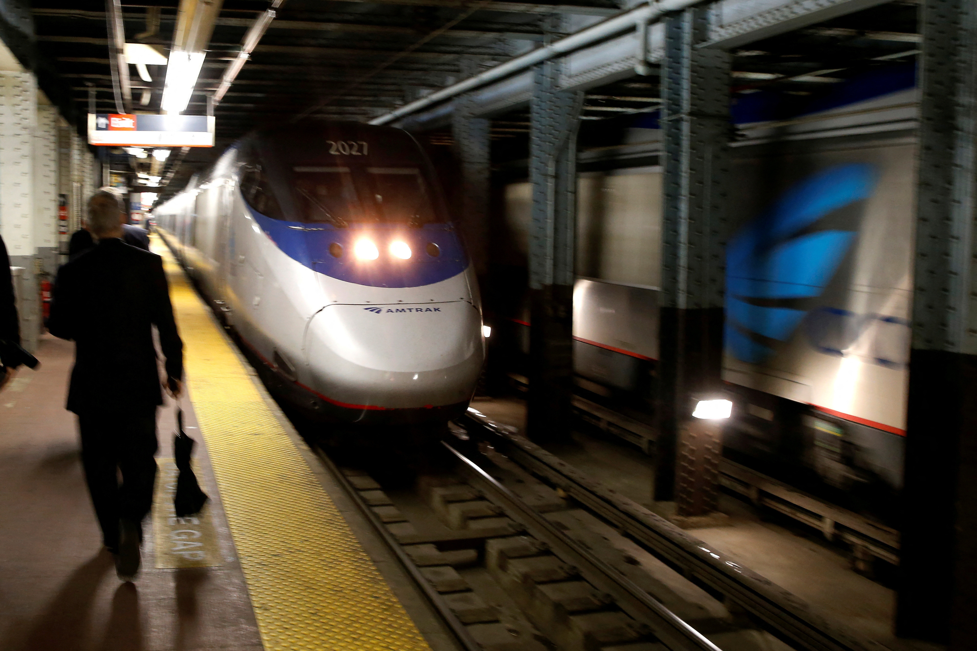 An Amtrak Acela train arrives at New York's Penn Station, the nation's busiest train hub, near a section of a complex of tracks that Amtrak says they will begin repairing over the summer in New York City