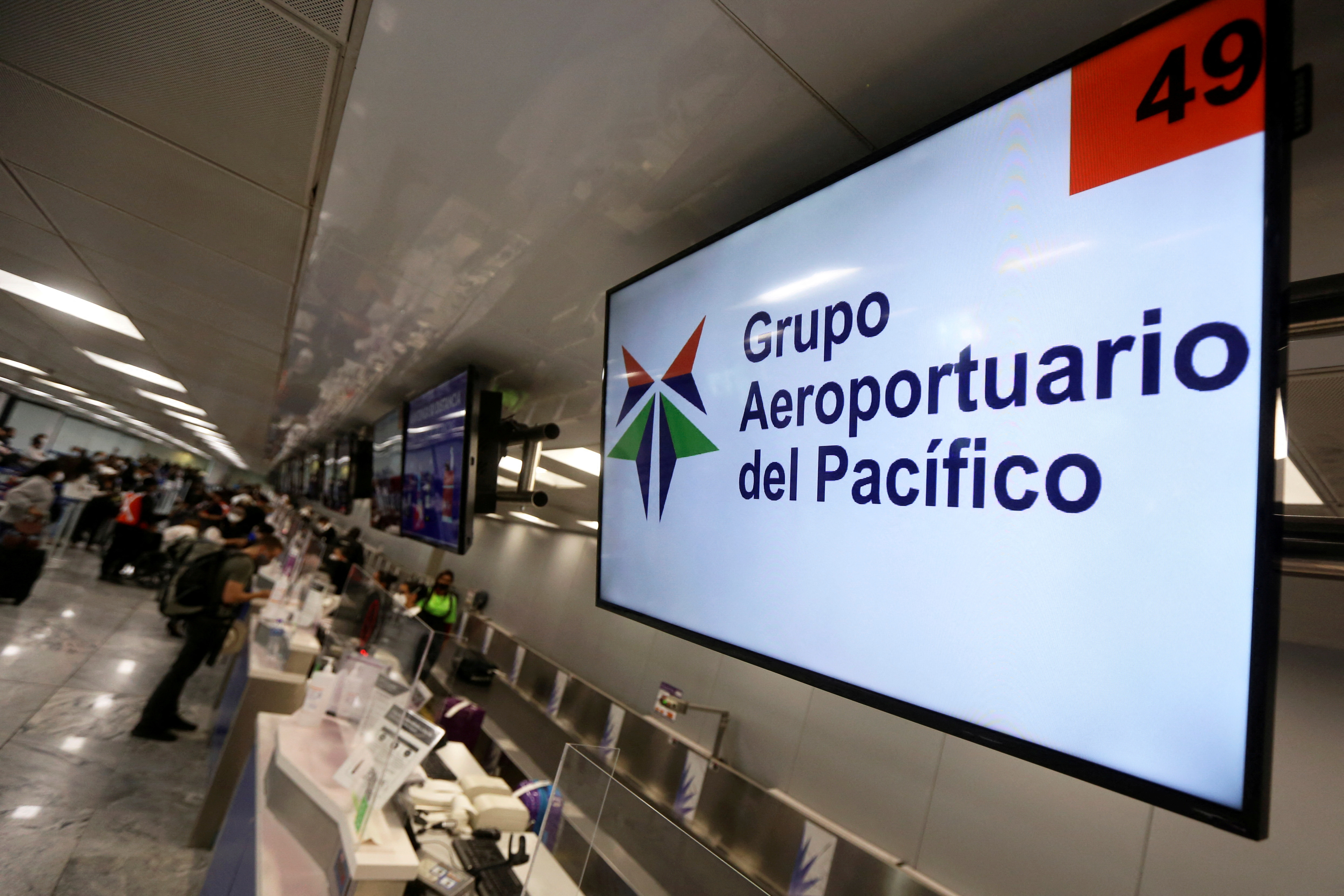 A screen displays the logo of Mexican airport operator Grupo Aeroportuario del Pacifico (GAP) at the Miguel Hidalgo y Costilla International Airport, in Guadalajara