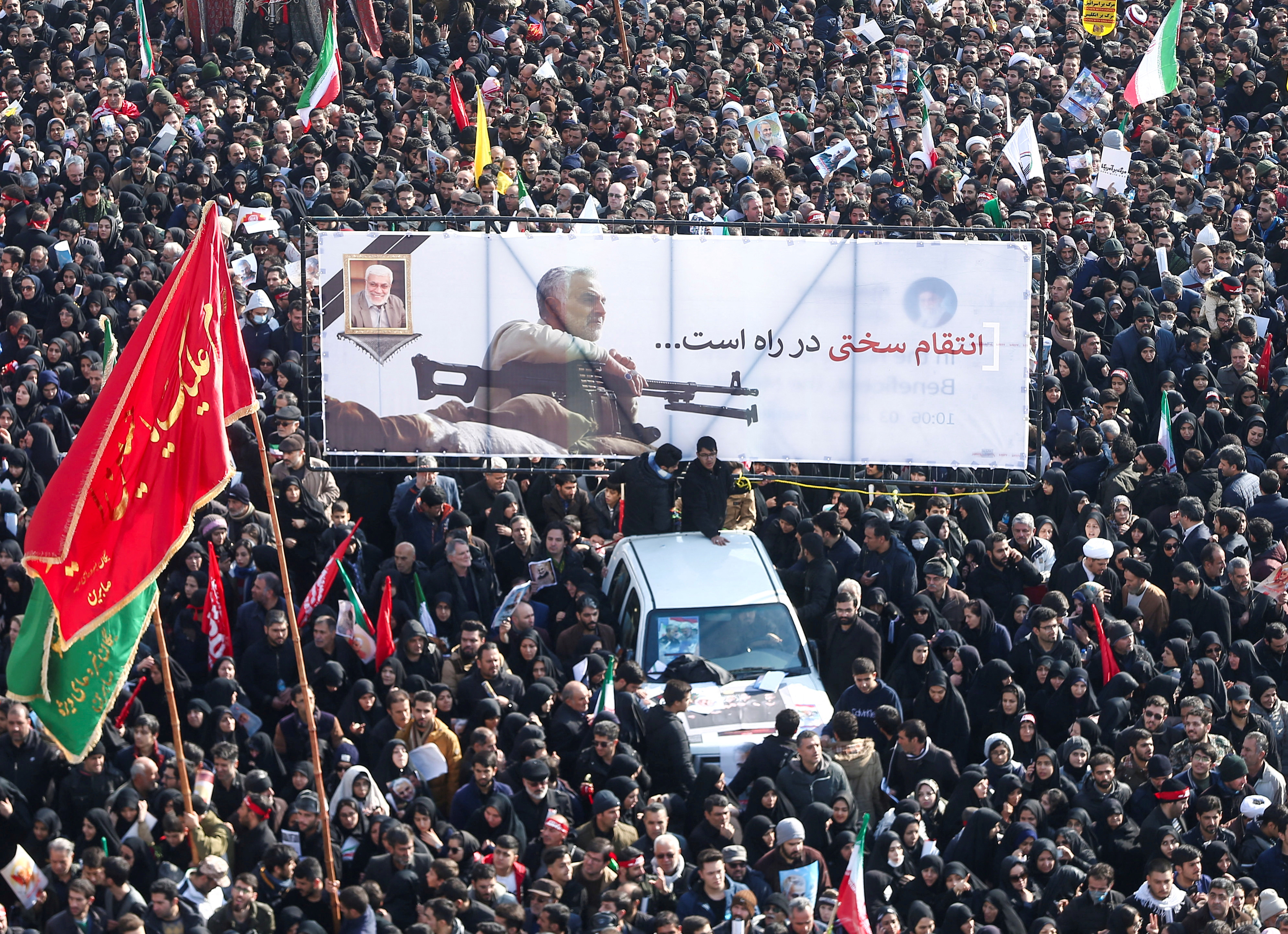 Iranian people attend a funeral procession for Iranian Major-General Qassem Soleimani, head of the elite Quds Force, and Iraqi militia commander Abu Mahdi al-Muhandis, who were killed in an air strike at Baghdad airport, in Tehran, Iran January