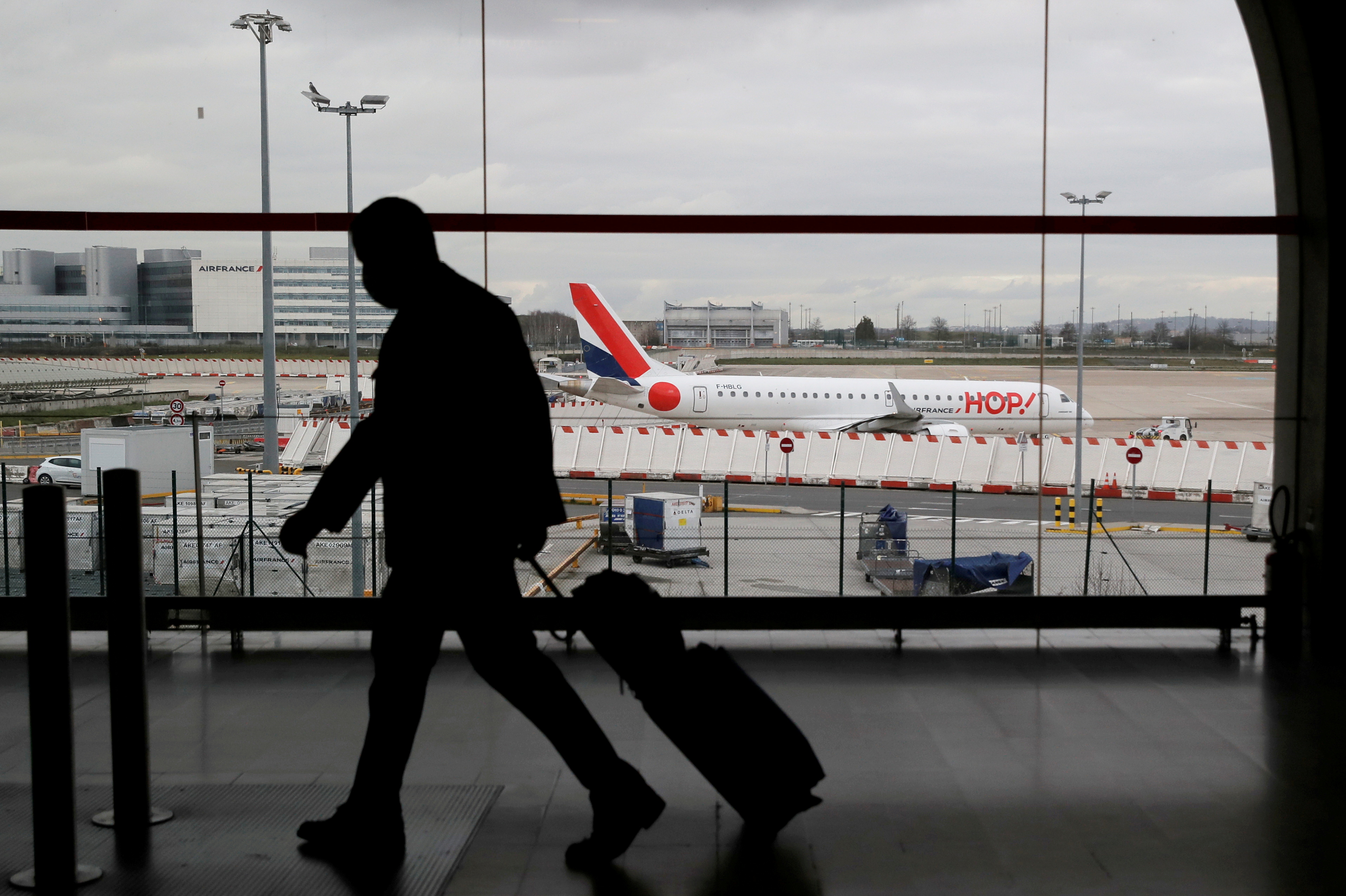 A man walks through a terminal at Paris Charles de Gaulle airport near Paris