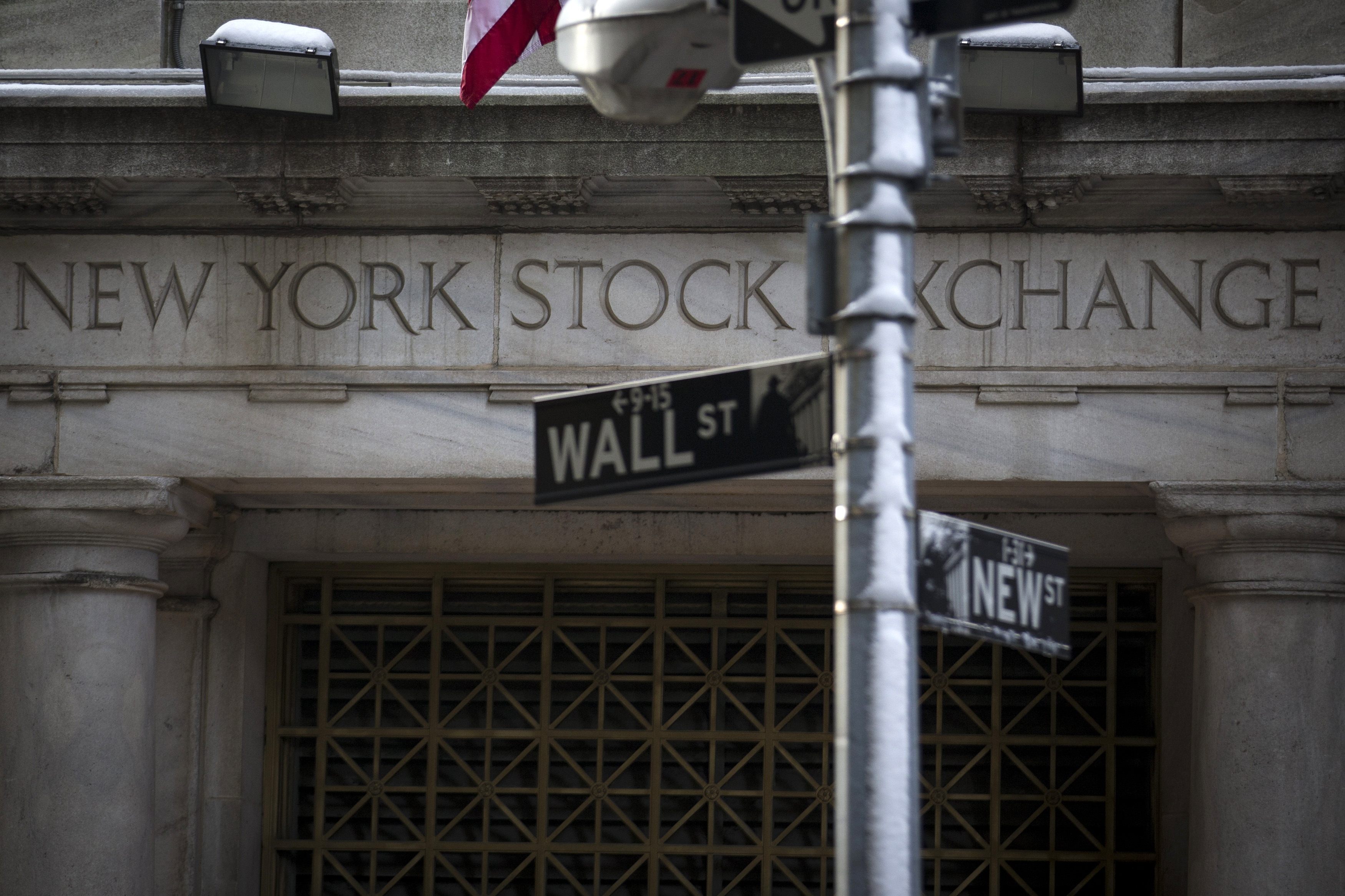 The Wall St. sign is seen outside the door to the New York Stock Exchange in New York's financial district