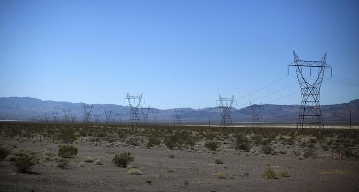 Electricity transmission towers are seen in the Nevada desert near the Copper Mountain Solar Project in Boulder City, Nevada,
