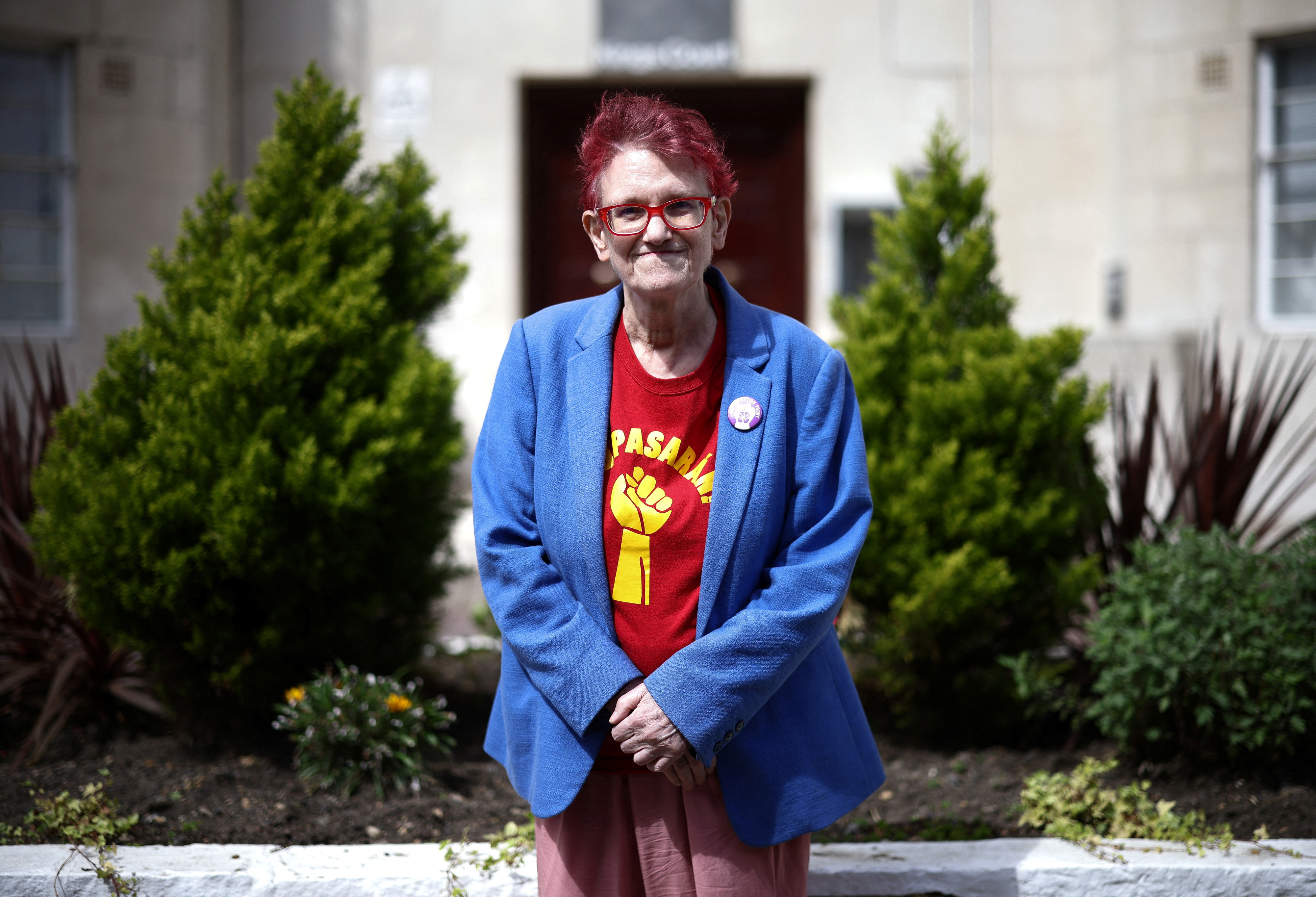 Nettie Pollard, 72, who is an LGBTQ and women's liberation activist, poses outside her home in London