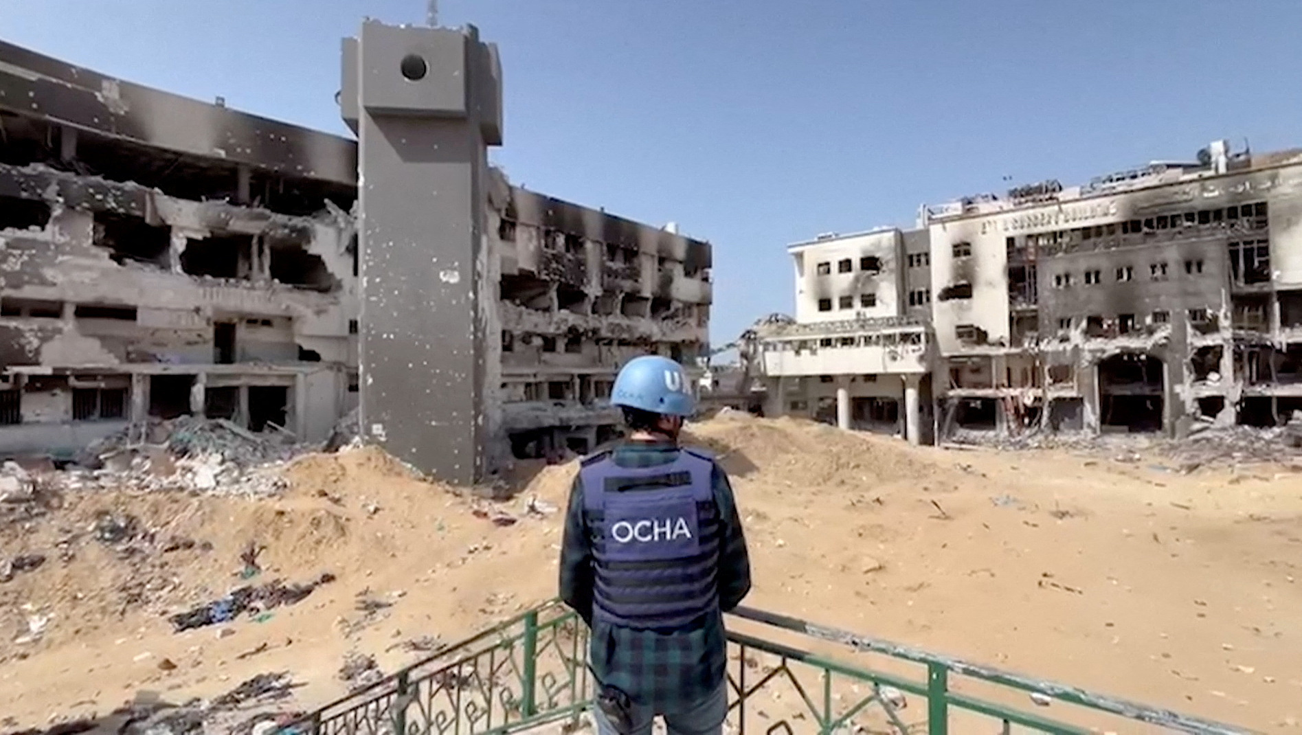 Jonathan Whittall, an OCHA official, stands near the destroyed Al Shifa Hospital in Gaza City
