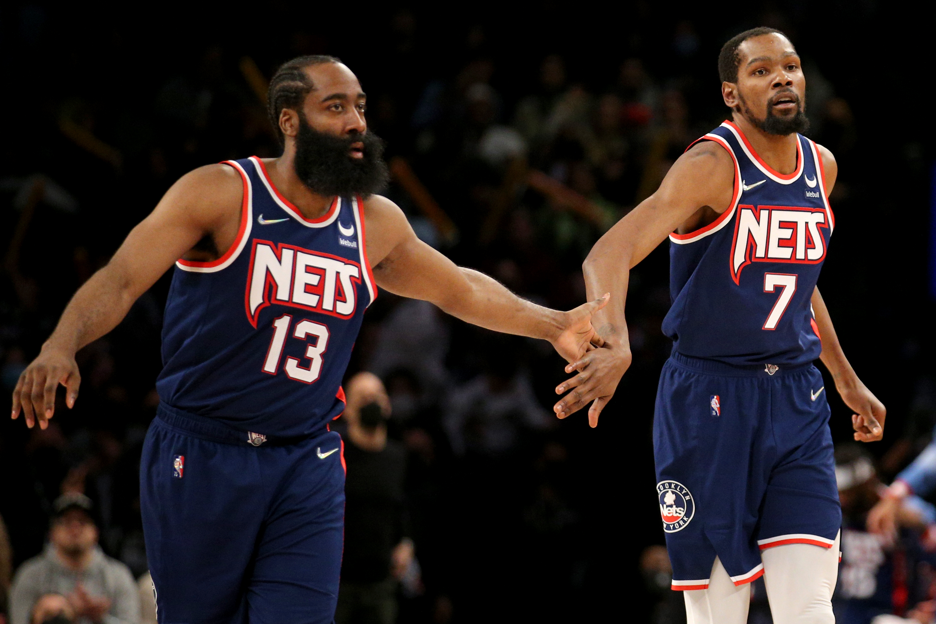 Dec 3, 2021; Brooklyn, New York, USA; Brooklyn Nets forward Kevin Durant (7) celebrates with guard James Harden (13) after a basket against the Minnesota Timberwolves during the fourth quarter at Barclays Center./Brad Penner-USA TODAY Sports