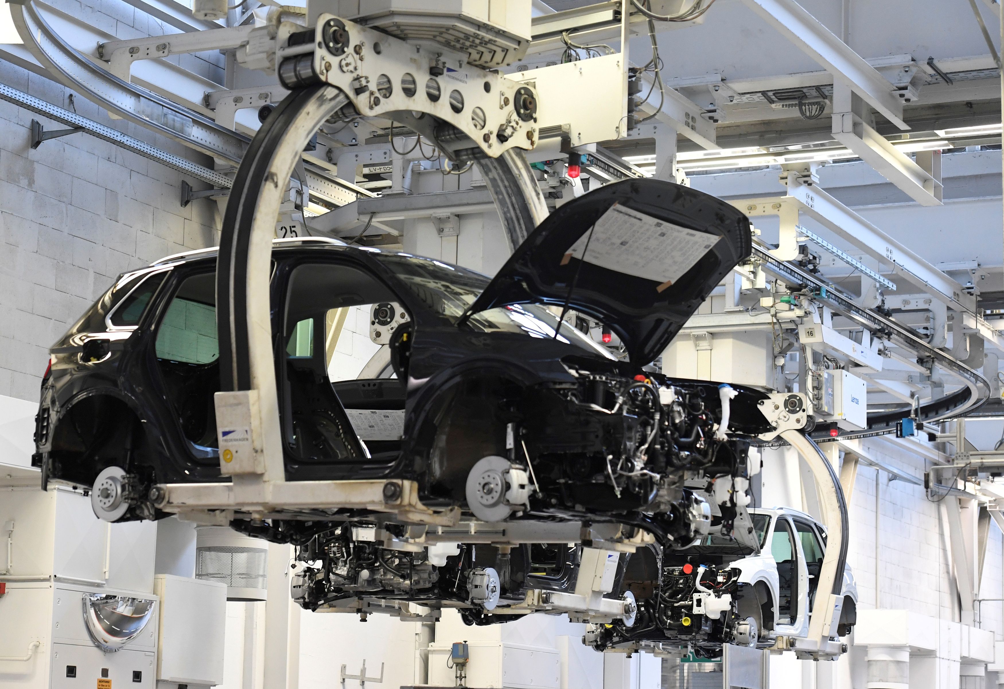 A car body is moved in a production line at the Volkswagen plant in Wolfsburg