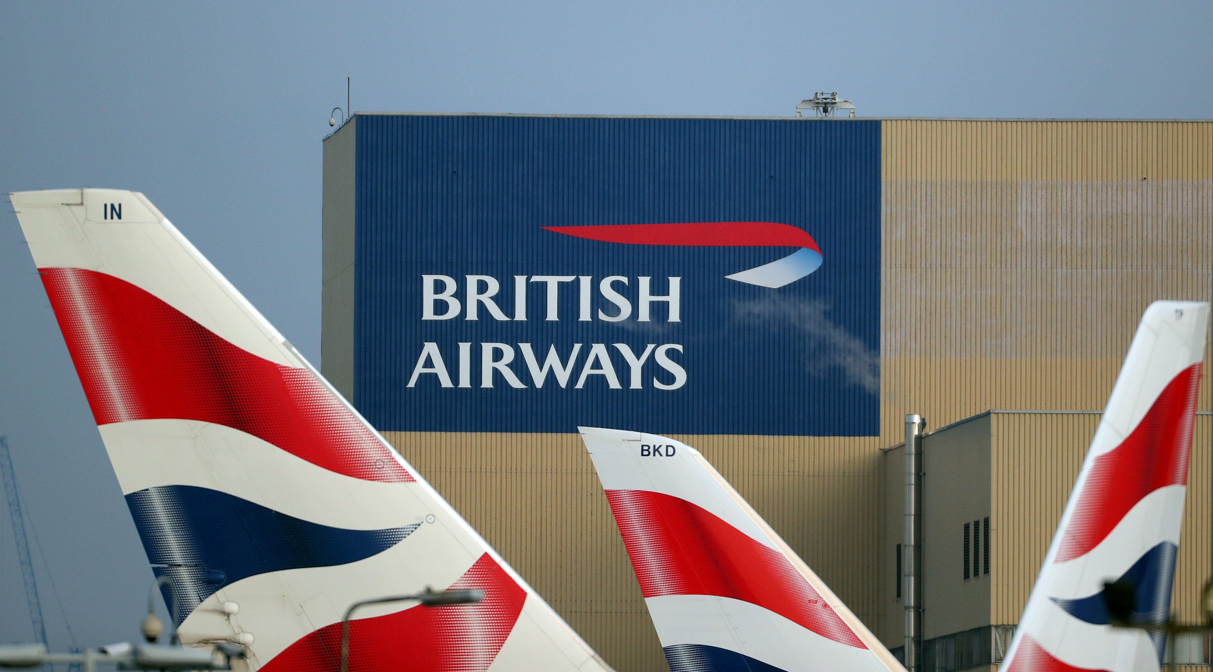 British Airways logos are seen on tail fins at Heathrow Airport in west London