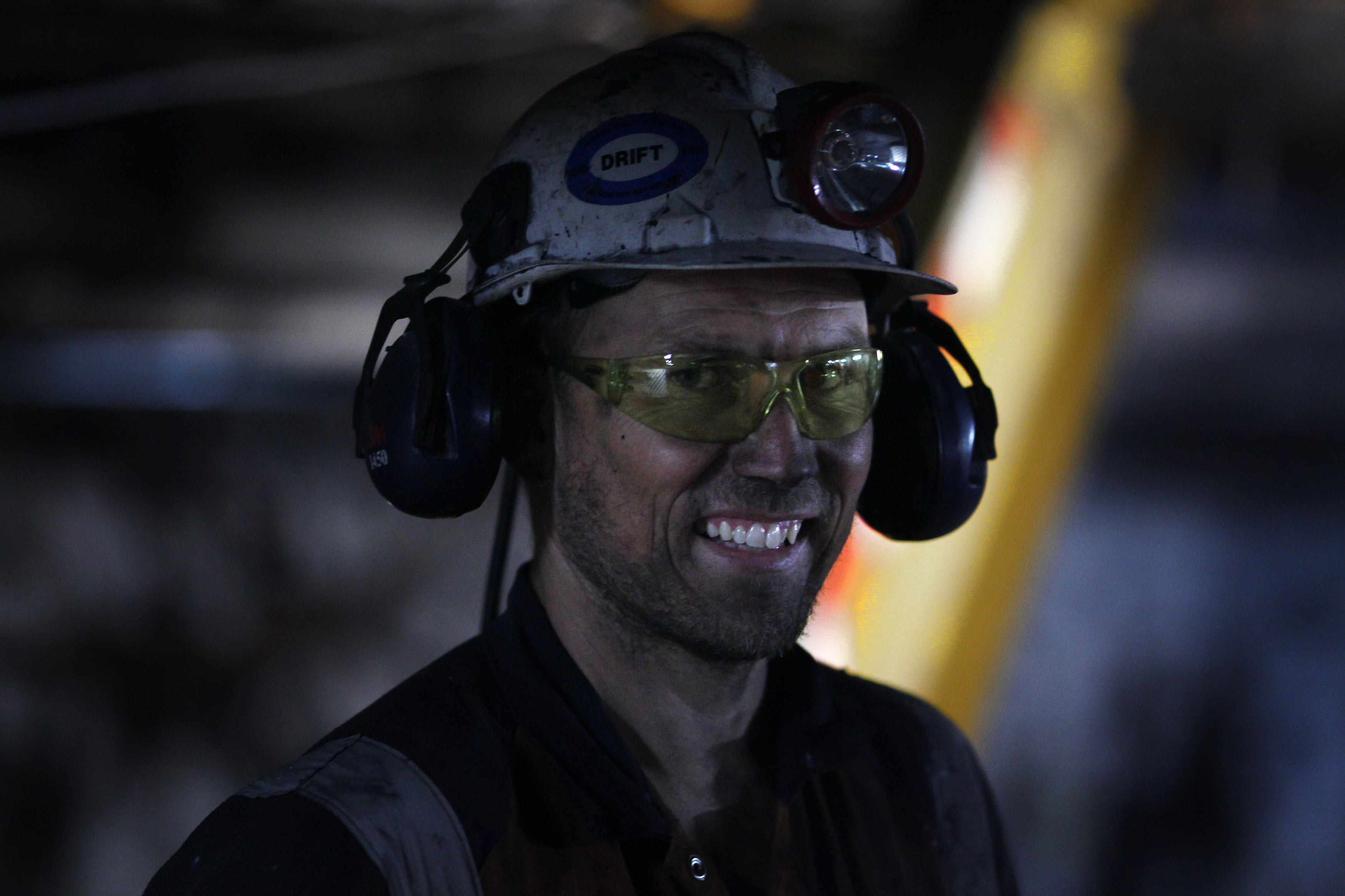 A coal miner smiles as he exits the Metropolitan coal mine at Helensburgh