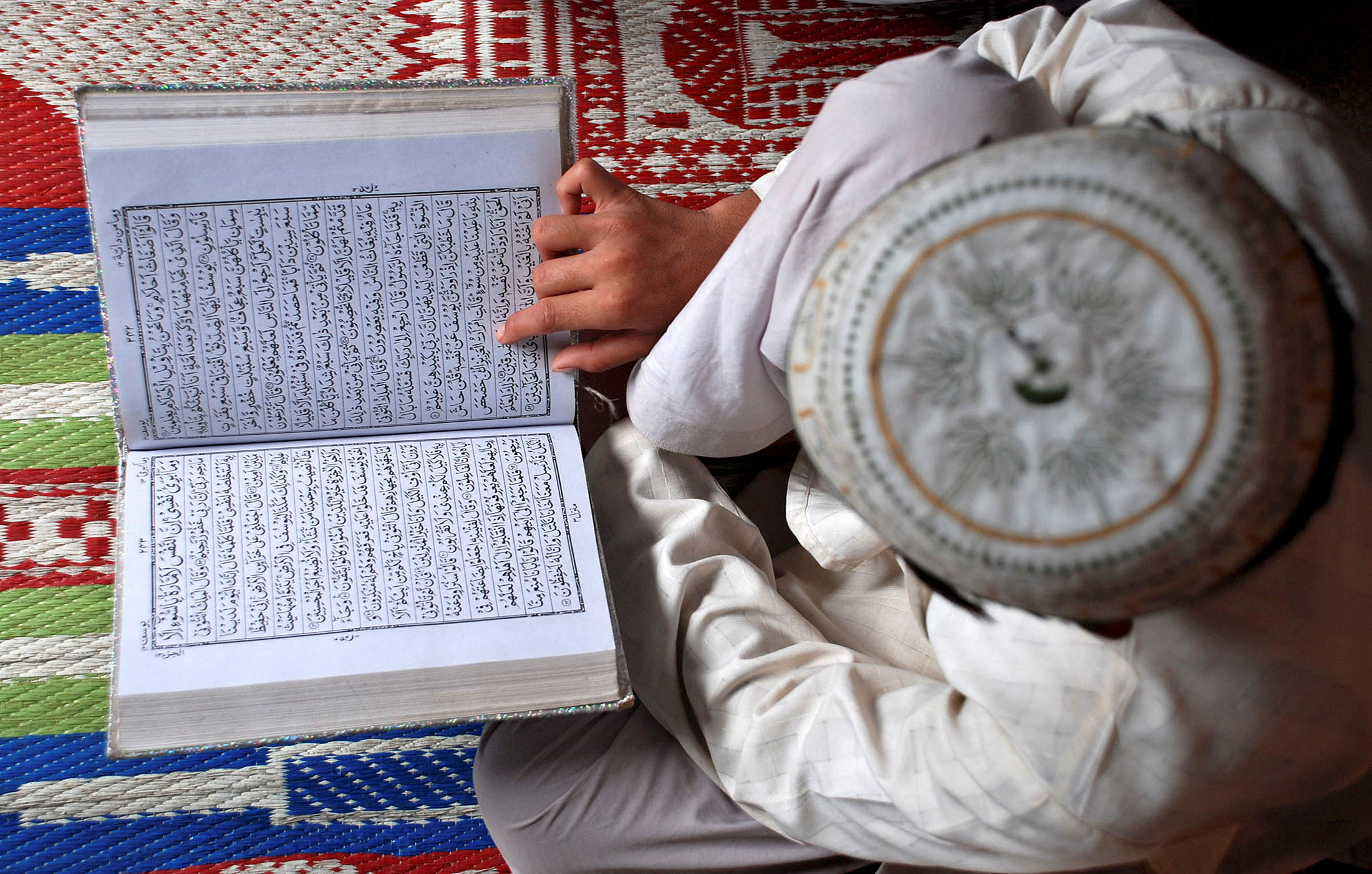 A Muslim boy reads the Koran at a madrasa in Mathura, India