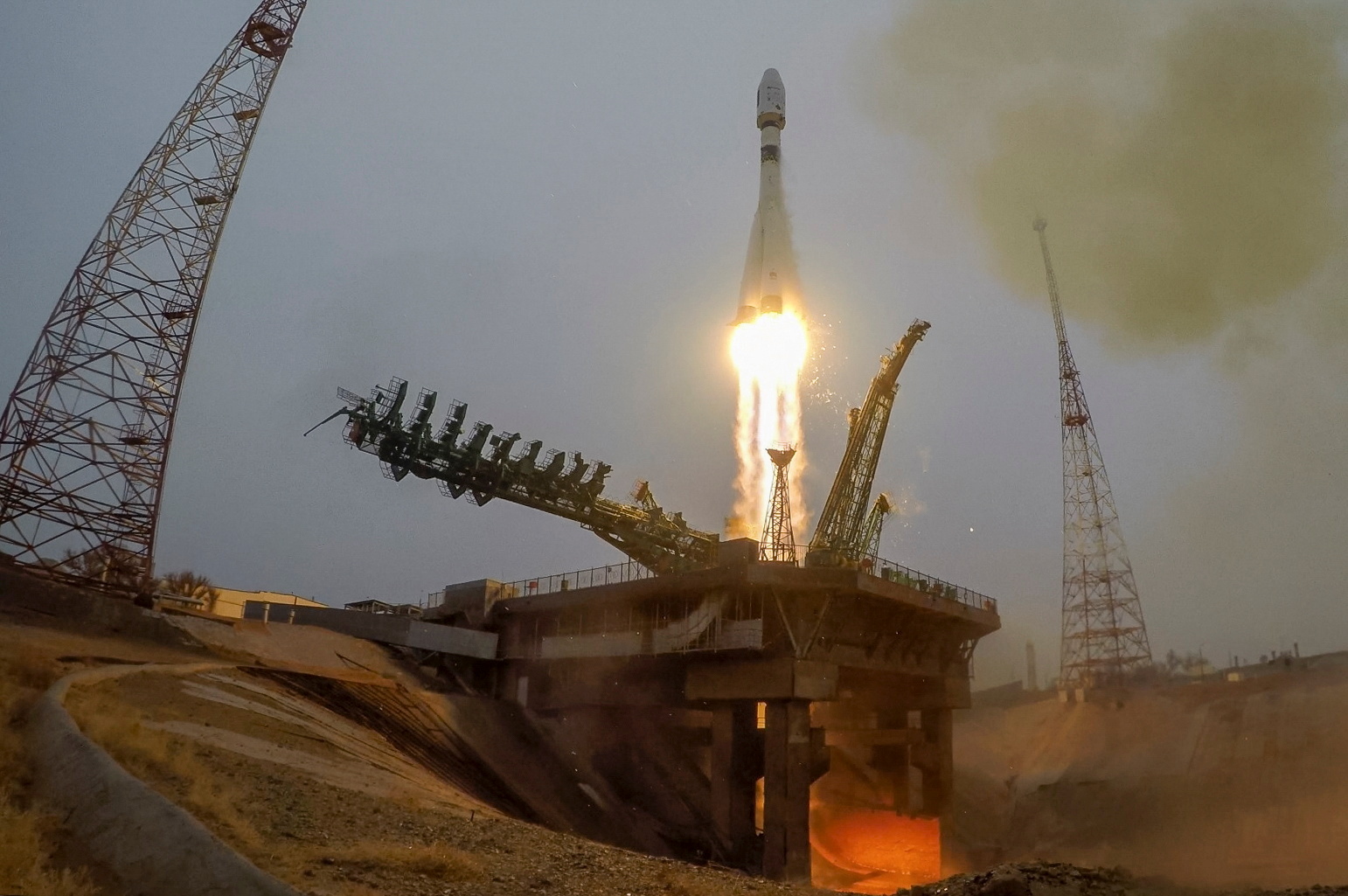 A rocket with 38 satellites blasts off from a launchpad at the Baikonur Cosmodrome