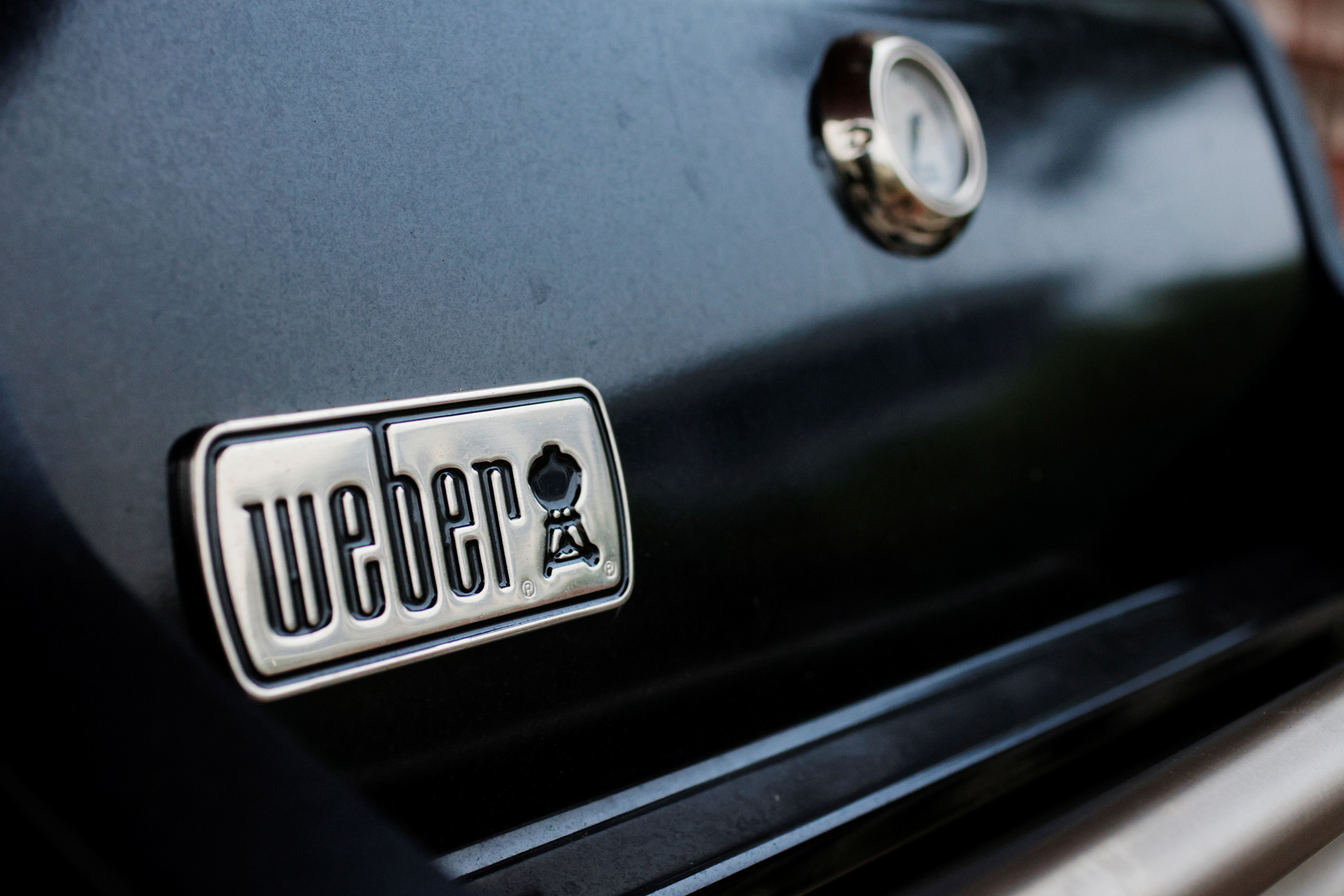 A Weber grill stands on a porch in Gloucester