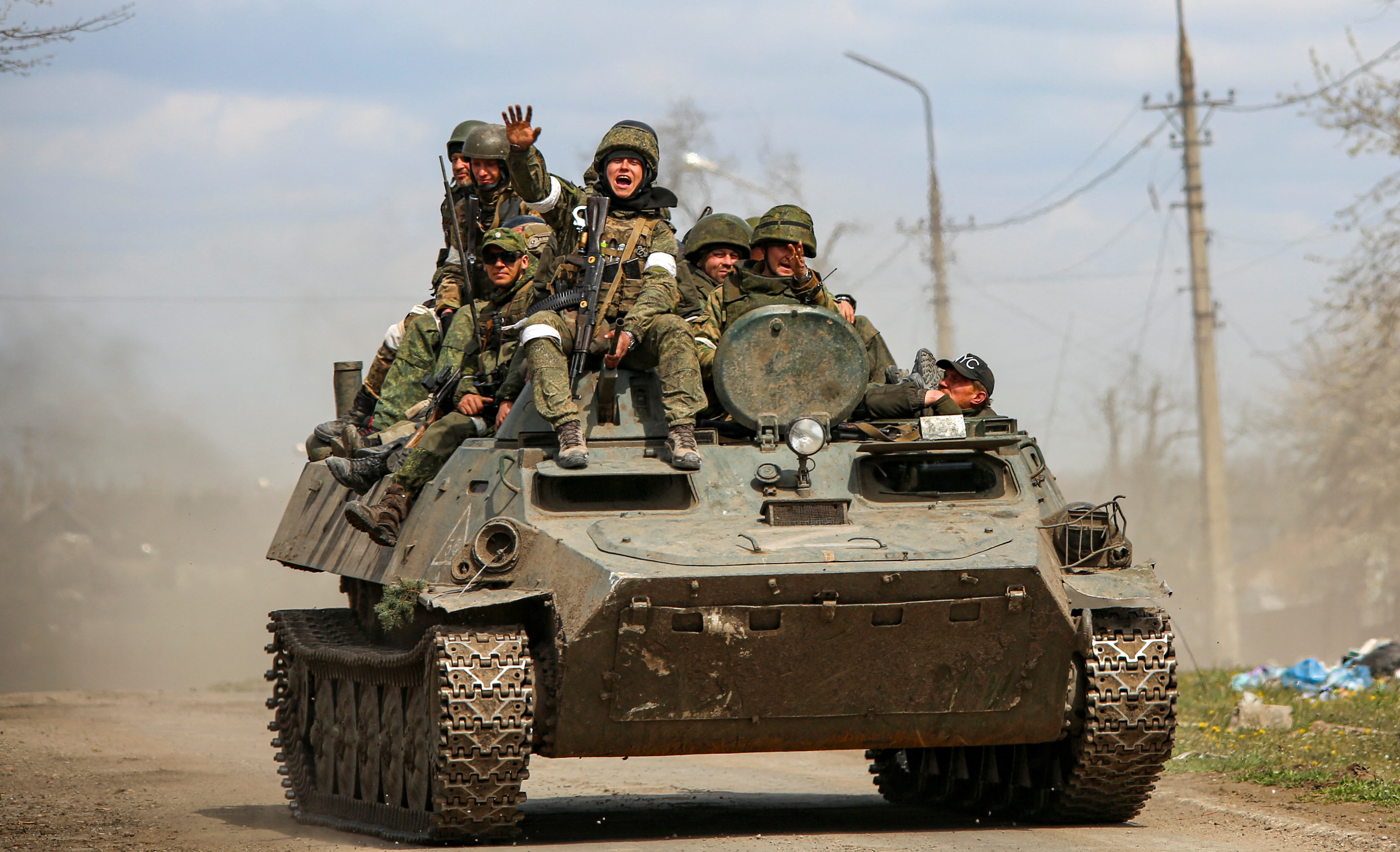 An armoured convoy of pro-Russian troops moves along a road in Mariupol