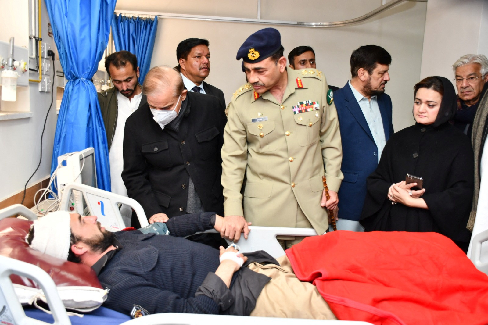 Chief of Army Staff of Pakistan Asim Munir and Pakistan's Prime Minister Shehbaz Sharif visit an injured, at a hospital in Peshawar
