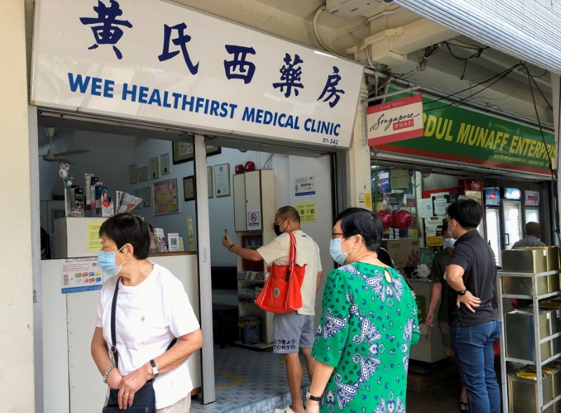 People queue to enquire about Sinovac vaccine at a clinic, during the coronavirus disease (COVID-19) outbreak in Singapore