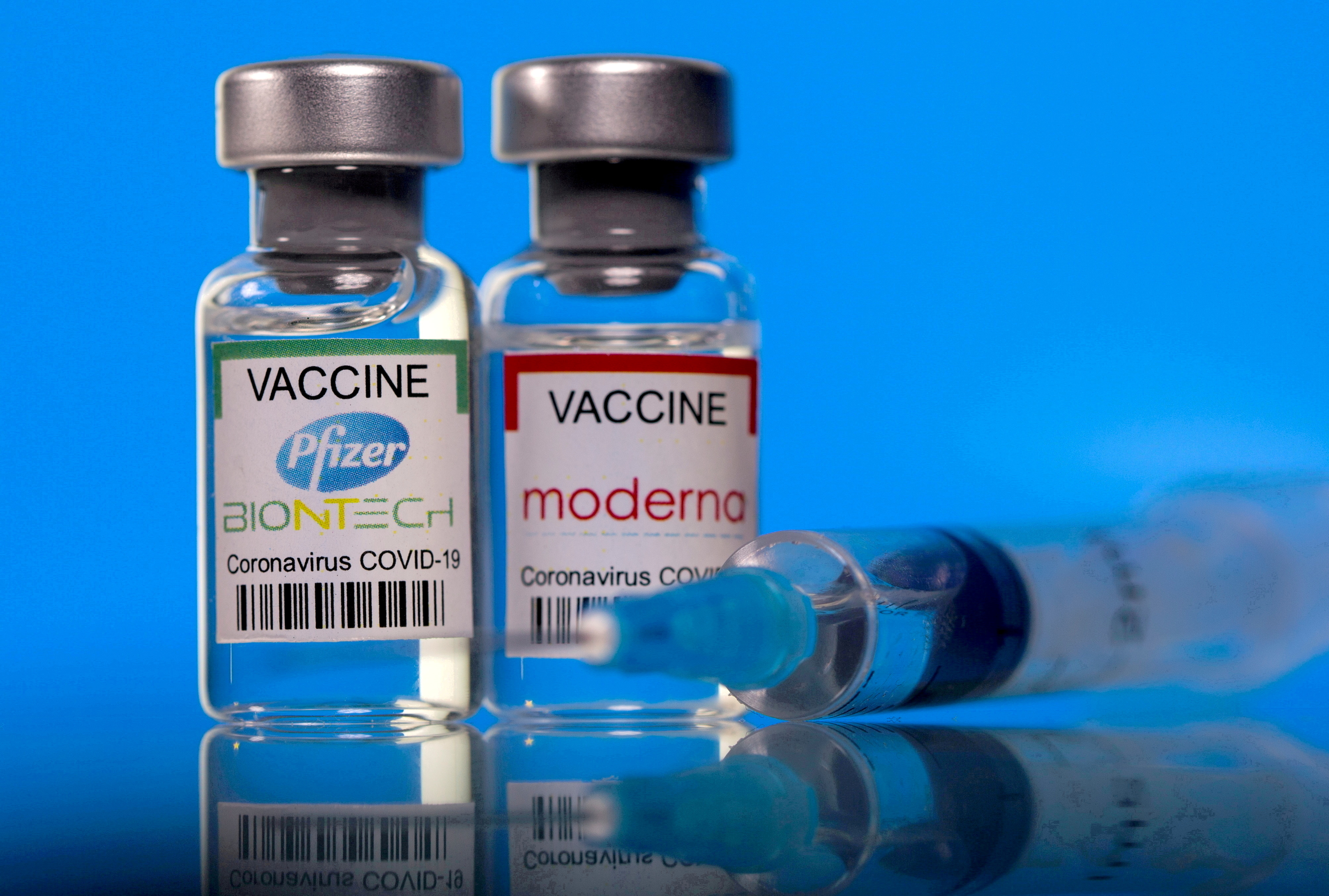 Picture illustration of vials with Pfizer-BioNTech and Moderna coronavirus disease (COVID-19) vaccine labels